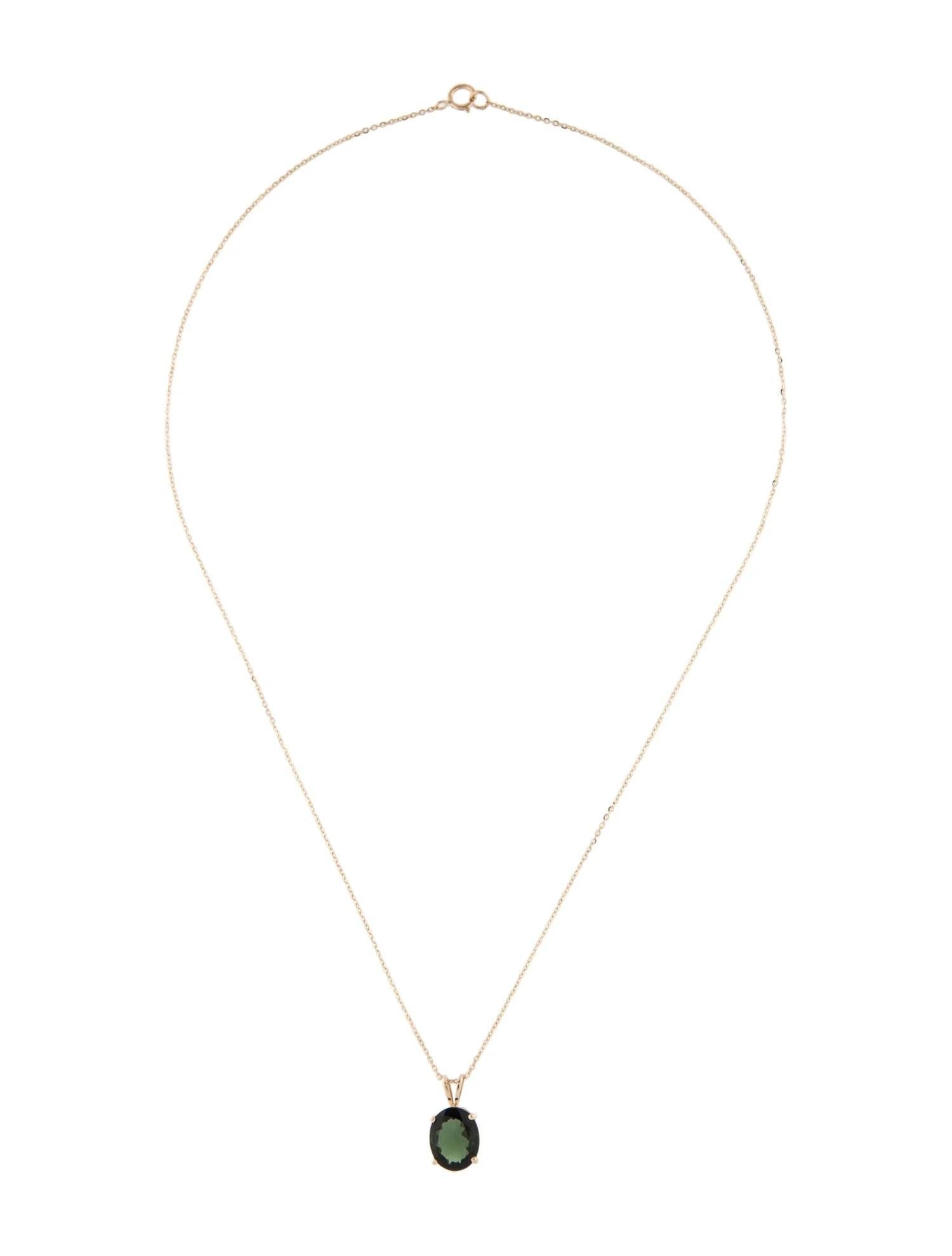 Elevate your style with this exquisite 14K yellow gold pendant necklace featuring a stunning oval green tourmaline as its centerpiece. The tourmaline, with a generous carat weight of 2.79, showcases captivating hues of green, adding a touch of
