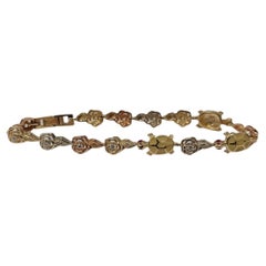  14k Tr-Tone Ladies turtle & Flower Diamond Bracelet 