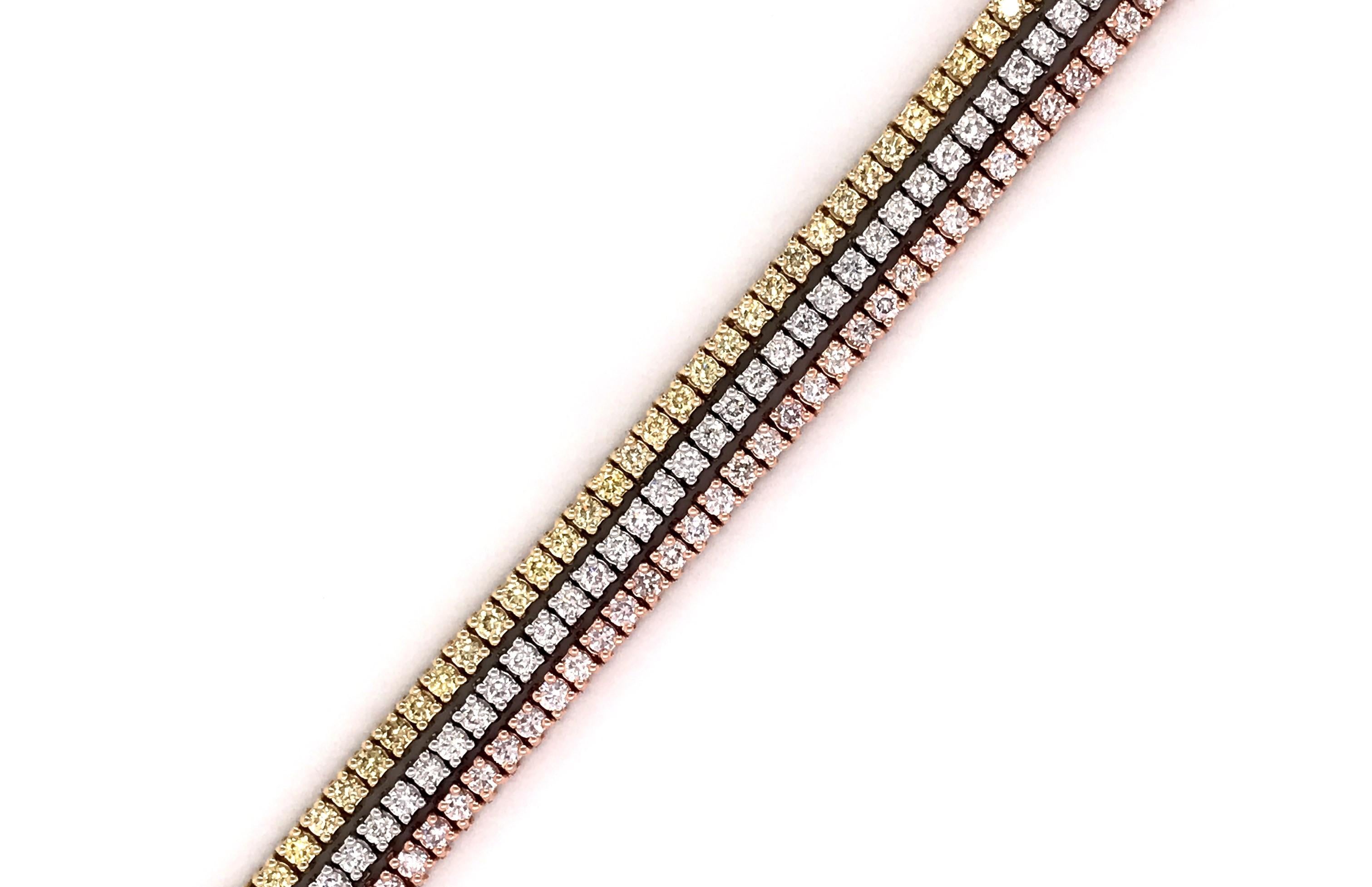 14 Karat Tri Gold Colored Round Cut Diamond 3 Layer Tennis Bracelet with 198 Round Cut Natural Diamonds in 4 Prong Basket setting.

Perfect piece of jewelry to match any outfit, and sturdy for everyday usage. Diamonds are expertly and carefully