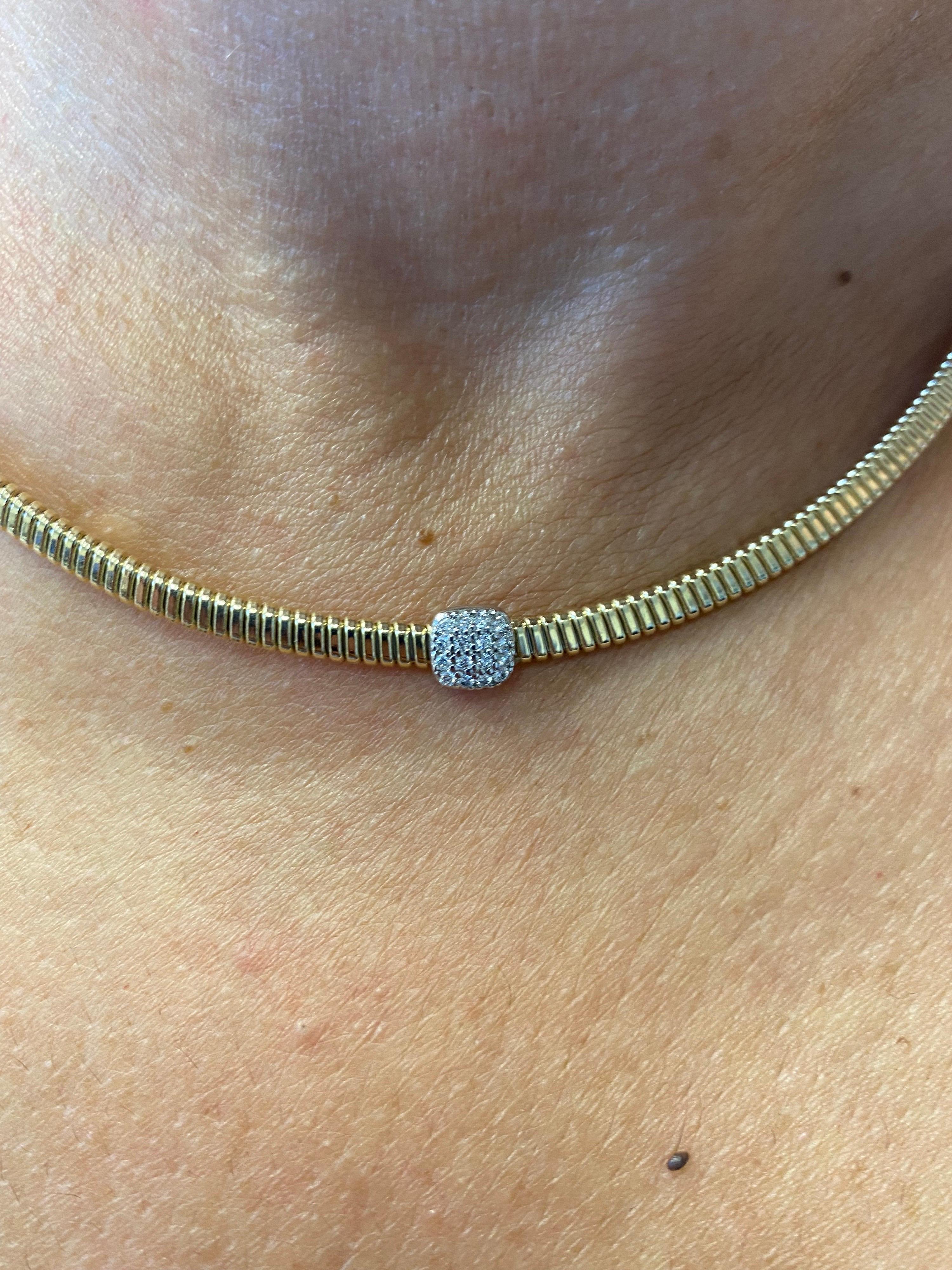 Diamond set in a Pave' in a Tubogas yellow gold necklace. The necklace is 14K and the carat weight is 0.42 carats. The color of the stones are F-G, the clarity is SI. The necklace is 16 inches long. 