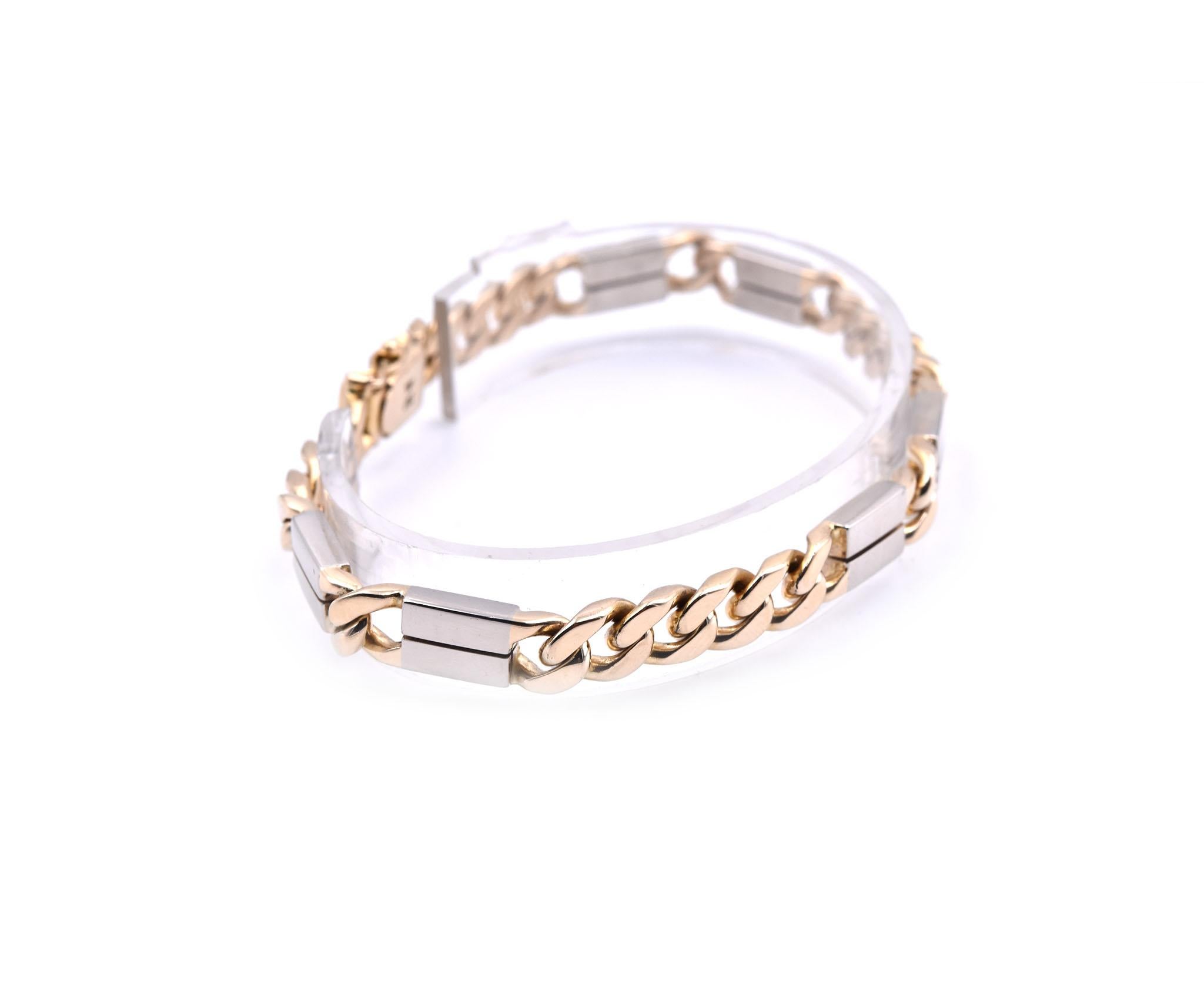 Designer: custom design 
Material: 14k yellow and white gold
Dimensions: bracelet will fit an 8-inch wrist, bracelet is 6.52mm wide
Weight: 33.60 grams
