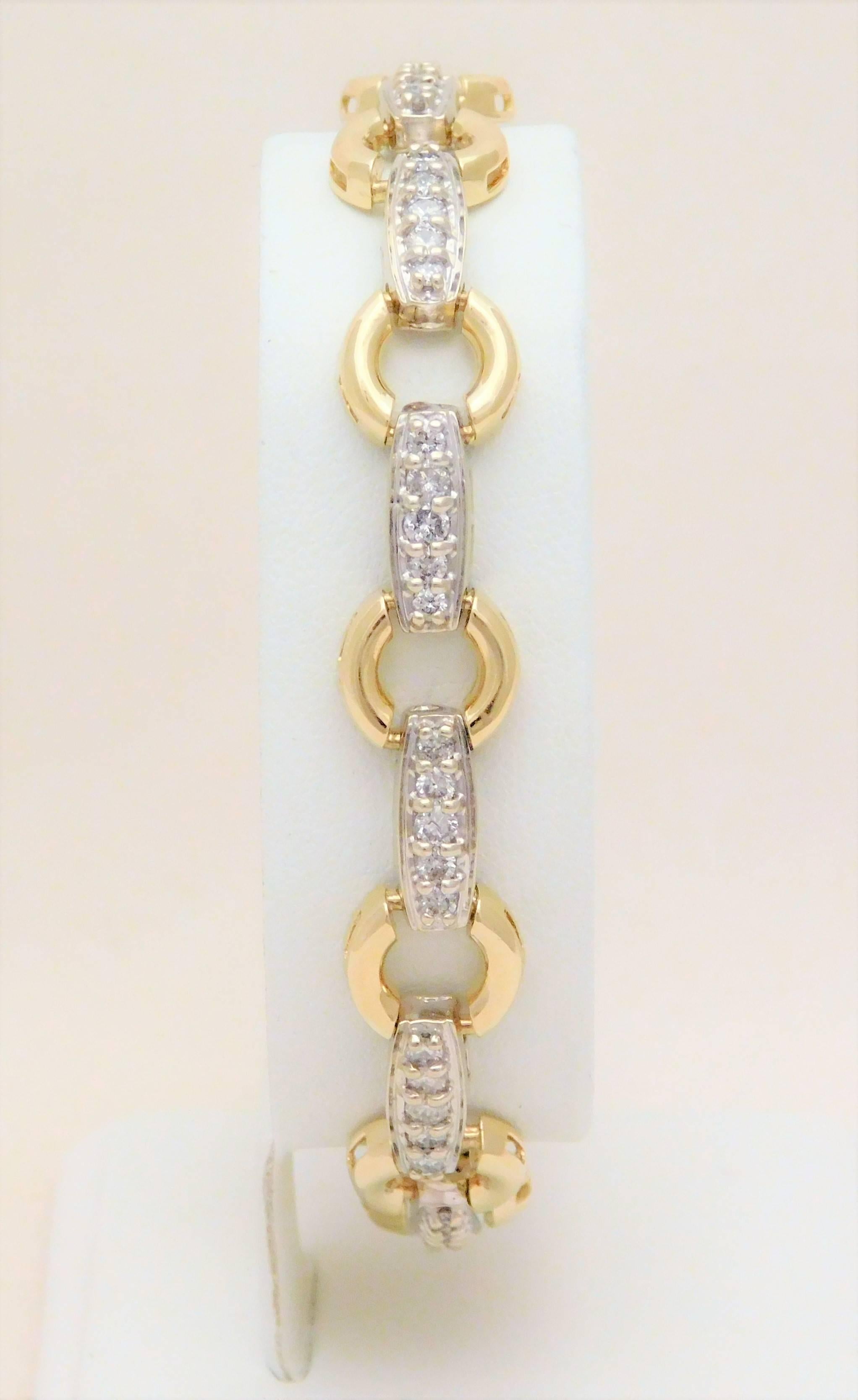 From an Southern estate.  Circa late 20th century.  This dazzling bracelet has been crafted in solid 14k yellow and 14k white gold.  It is masterfully jeweled with 55 bright and sparkling natural round brilliant-cut diamonds approximating 1.40ct in