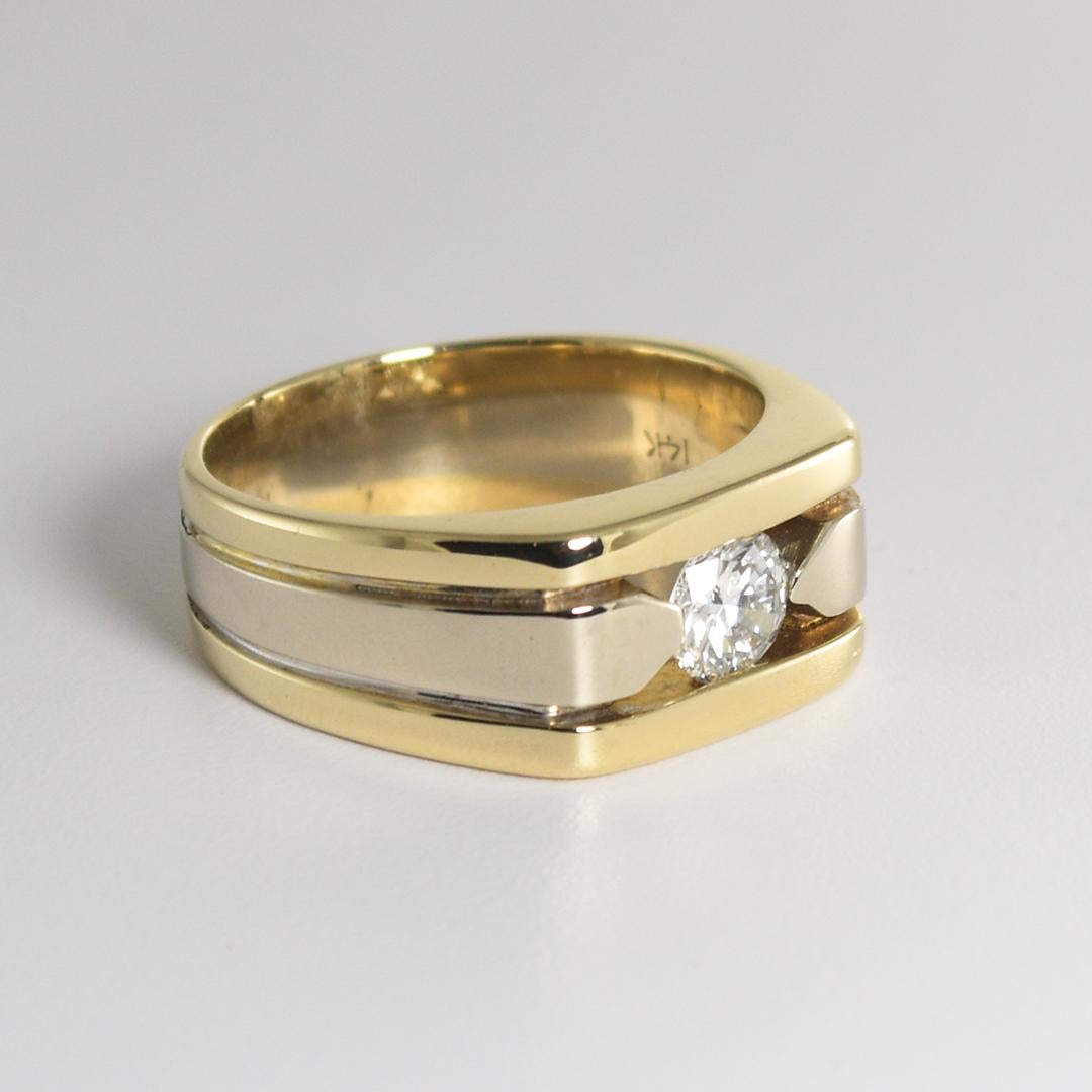 Diamond solitaire ring 14k yellow and white gold.
Stamped 14k and weighs 13.7 grams.
The diamond is a round brilliant cut, .75 carats, G to H color, VS clarity.
The center part of the ring is white gold and the outer is yellow gold.
The ring