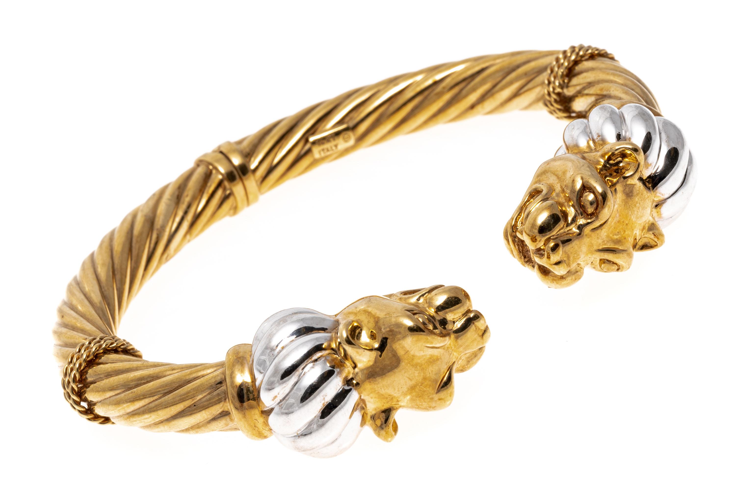 14k Two-Tone Facing Panther Head Twisted Hinged Cuff Bracelet
This eye-catching bracelet is a twisted hinged cuff featuring facing double panther heads, with a twisted white ribbed ruff.
Marks: 14k
Dimensions: 2 1/2