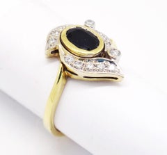 14 Karat Two-Tone Gold 1.7 Carat Oval Sapphire and Diamonds Ring