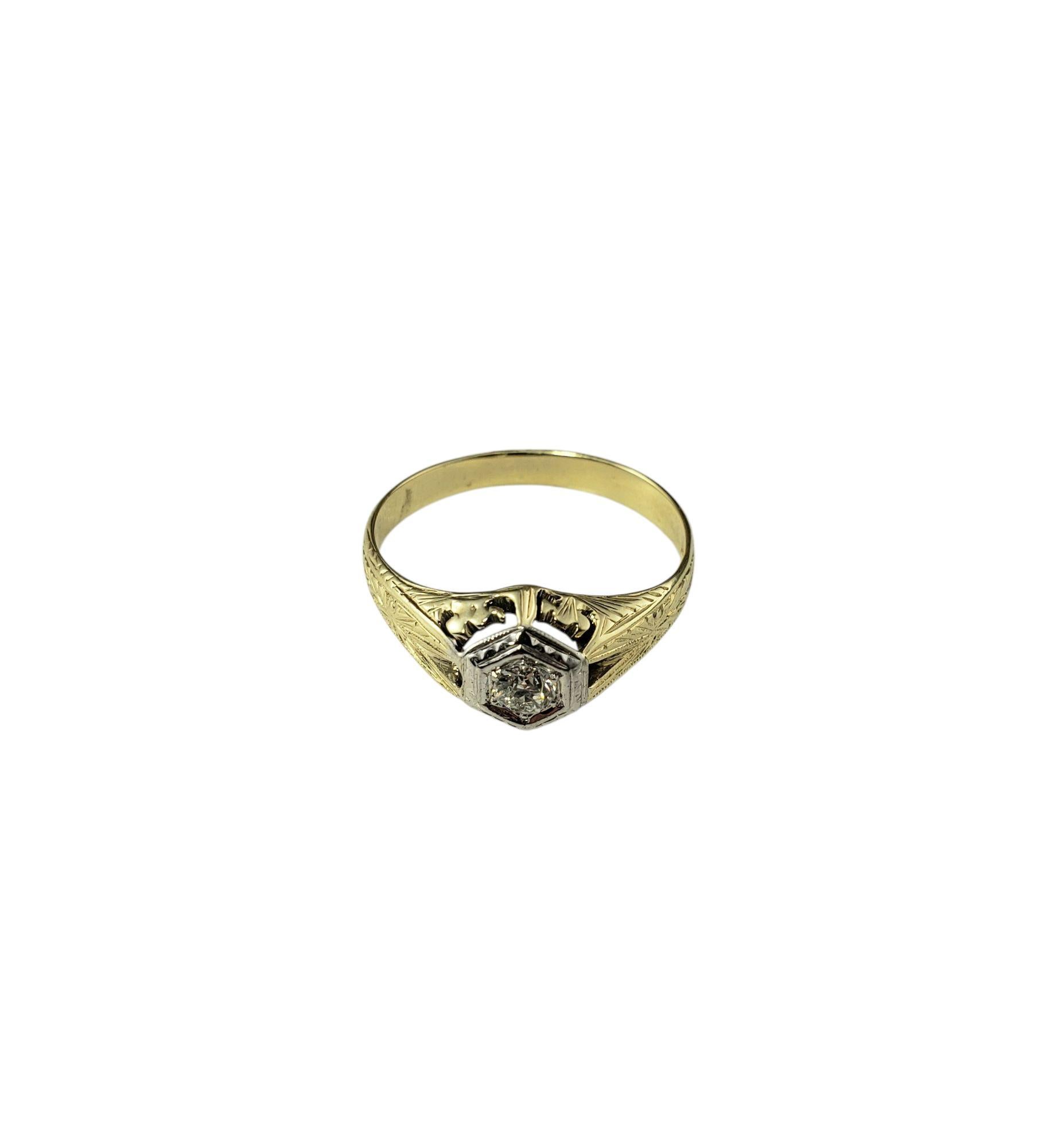 14K Two-Tone Gold Filigree and Diamond Art Deco Style Ring Size 8.25

This sparkling Art Deco style engagement ring features one round brilliant cut diamond set in beautifully detailed 14K white and yellow gold. Width: 9 mm. Shank: 3