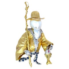 14K Two-Tone Gold Fisherman Brooch with Baroque Pearl, Diamond, Sapphire 
Ruby