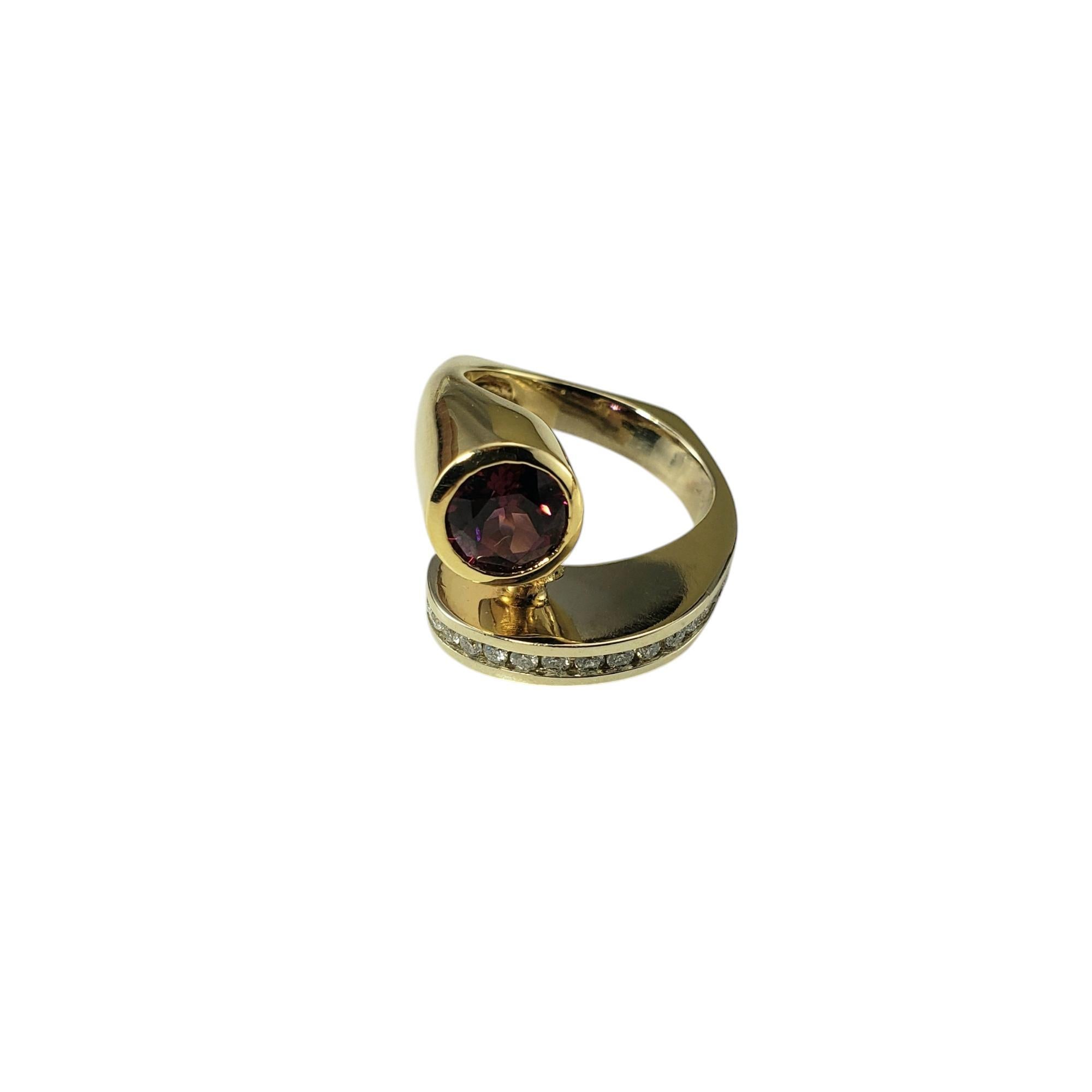 14K Yellow and White Gold Rhodolite Garnet and Diamond Bypass Ring Size 6.5 JAGi Certified-

This stunning bypass ring features one round cut rhodolite garnet and 16 round brilliant cut diamond set in 14K white and yellow gold.

Width: 14 mm. Shank: