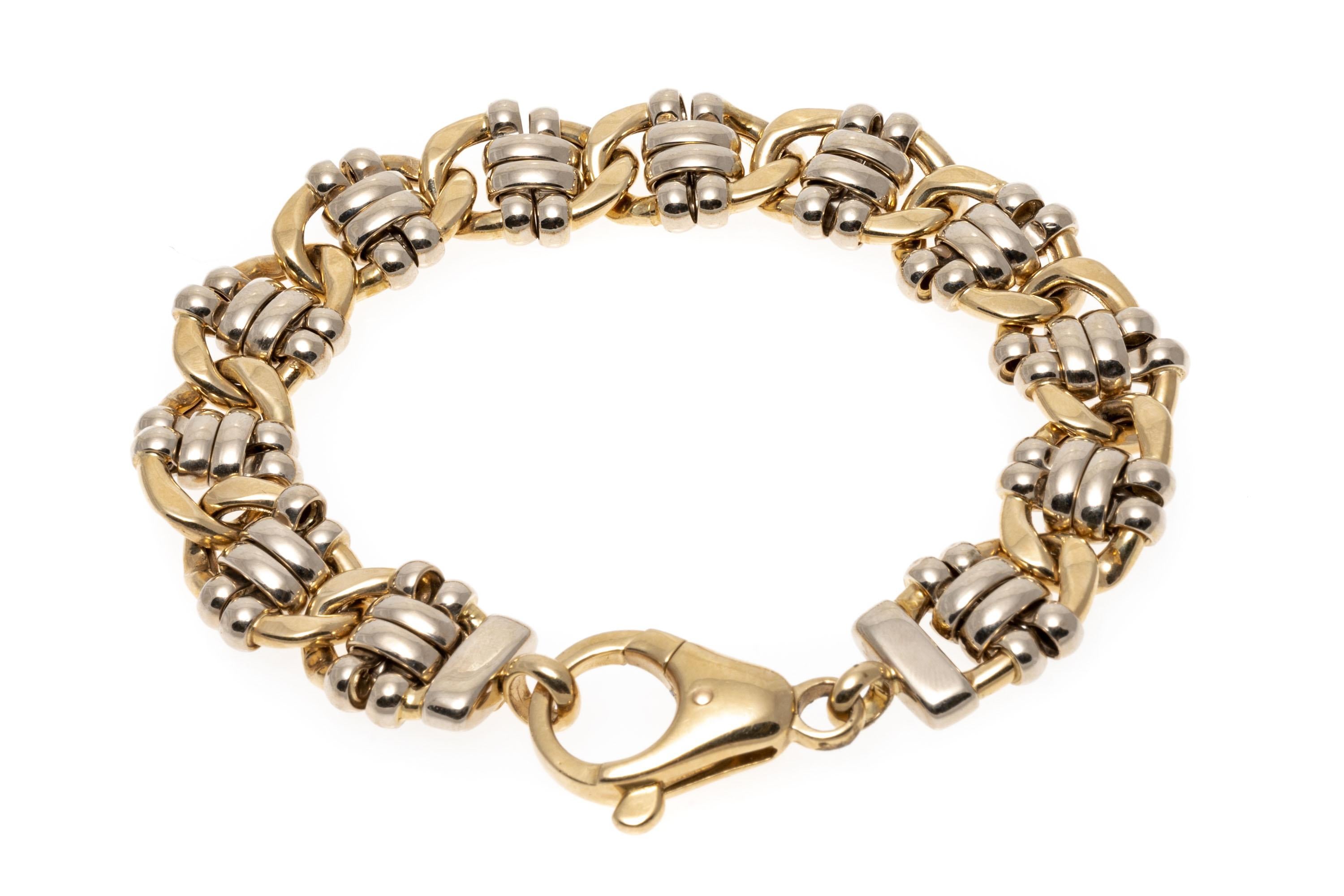 14k Two Tone Lovely High Polished Half Curb And Ribbed Link Bracelet.
This lovely bracelet is a high polished yellow gold jumbo half curb link bracelet, set in the center with high polished ribbed white gold center links. The bracelet has a jumbo