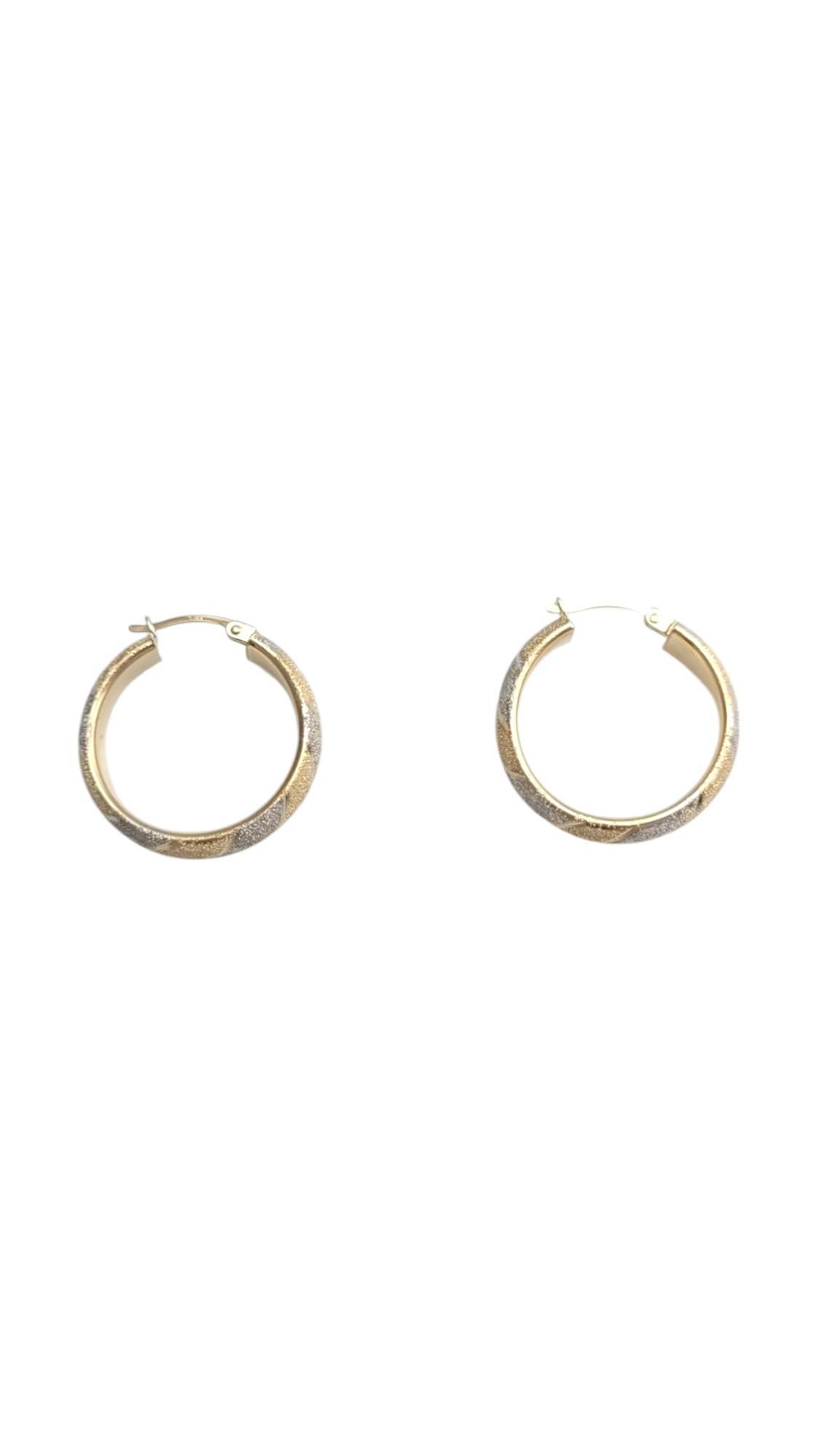 14K Two-Tone Yellow/White Gold Diamond Cut Hoop Earrings

Crafted in 14K yellow and white gold, these elegant hoops feature a hammered texture that shimmers with every movement. These hoops are perfect for any occasion.

Hallmark: S 14K

Weight: 4.6