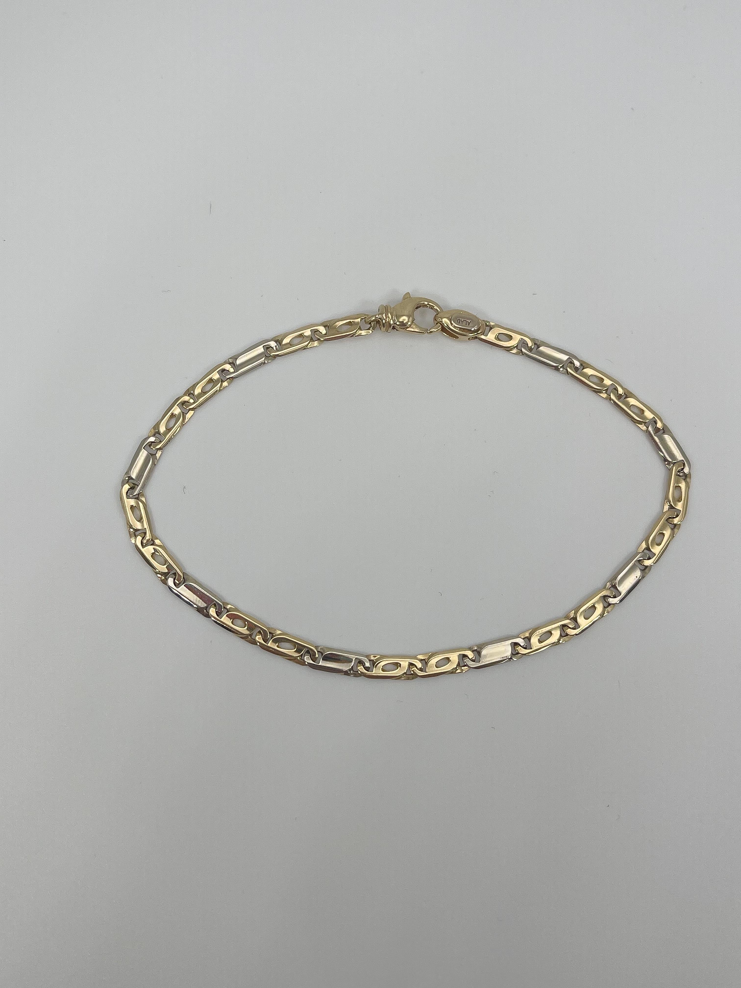 14k two toned men's fancy link bracelet. This bracelet has a length of 8 inches, a width of 3 mm, it has a lobster clasp to open and close, and it has a total weight of 6.3 grams.