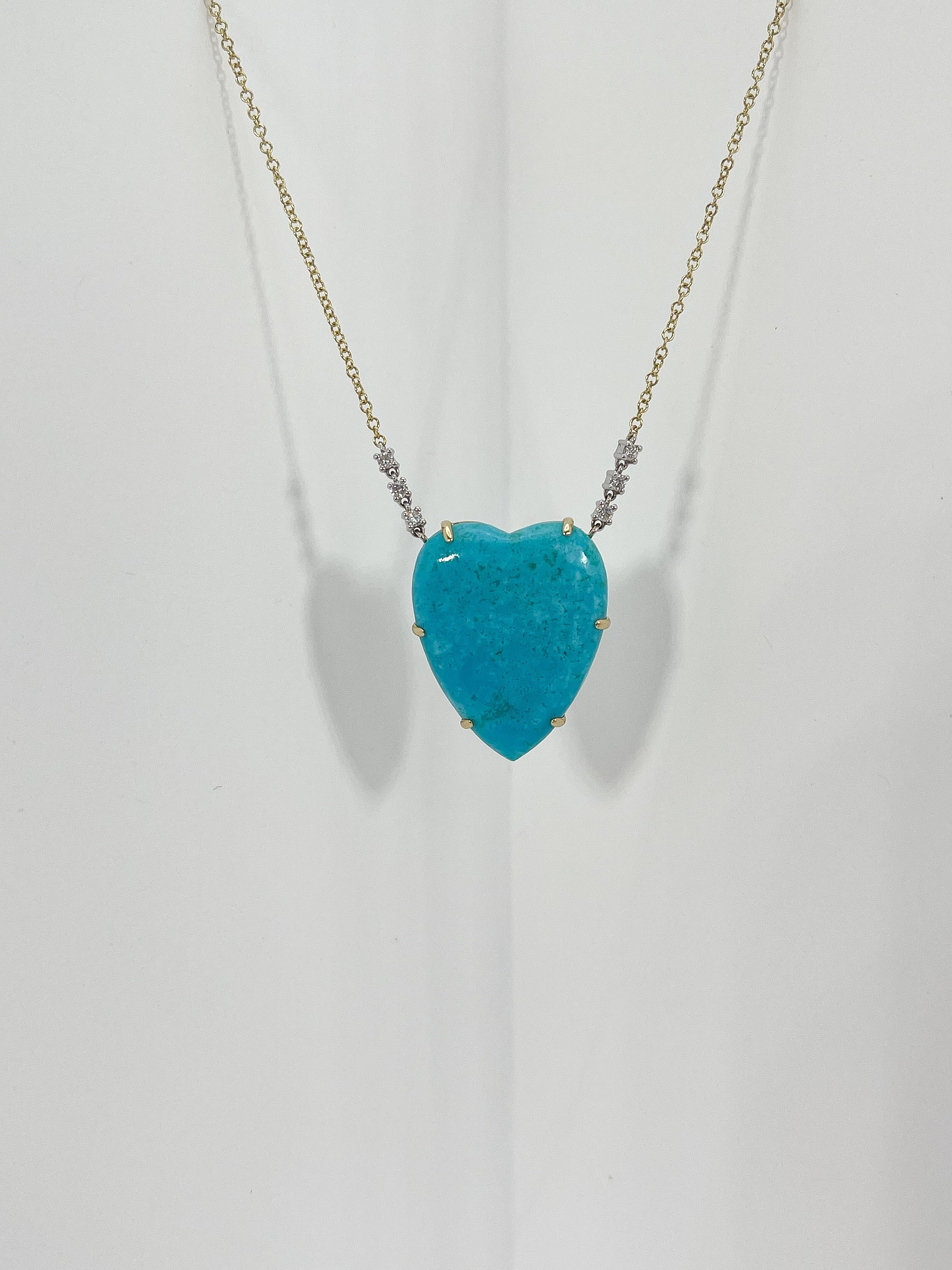 14k two toned turquoise heart and diamond necklace. Heart measures 23.8 x 19.5 mm,  3 round diamonds connecting to the heart on both sides of chain, the length of the necklace is 16 inches with an extension at 17'' and 18'', and the total weight of