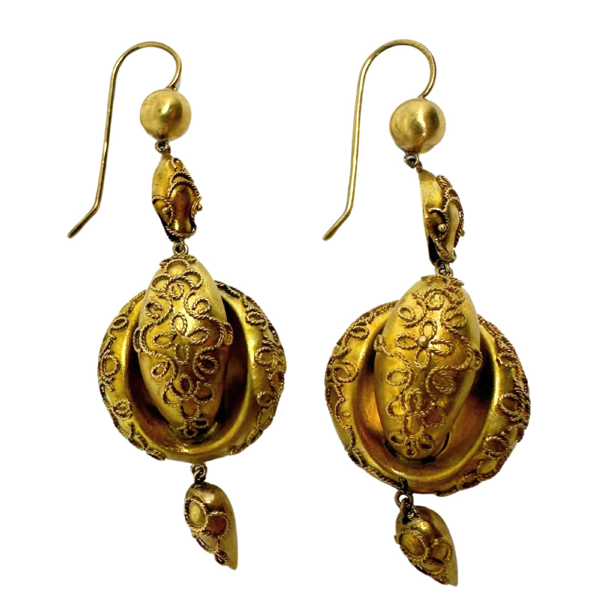 Elevate your look and embrace the elegance of the past with these 14k Victorian Drop Earrings. Made from 14k yellow gold, these earrings feature intricate details and a length of 2 inches for a refined touch. In good condition, they offer a timeless