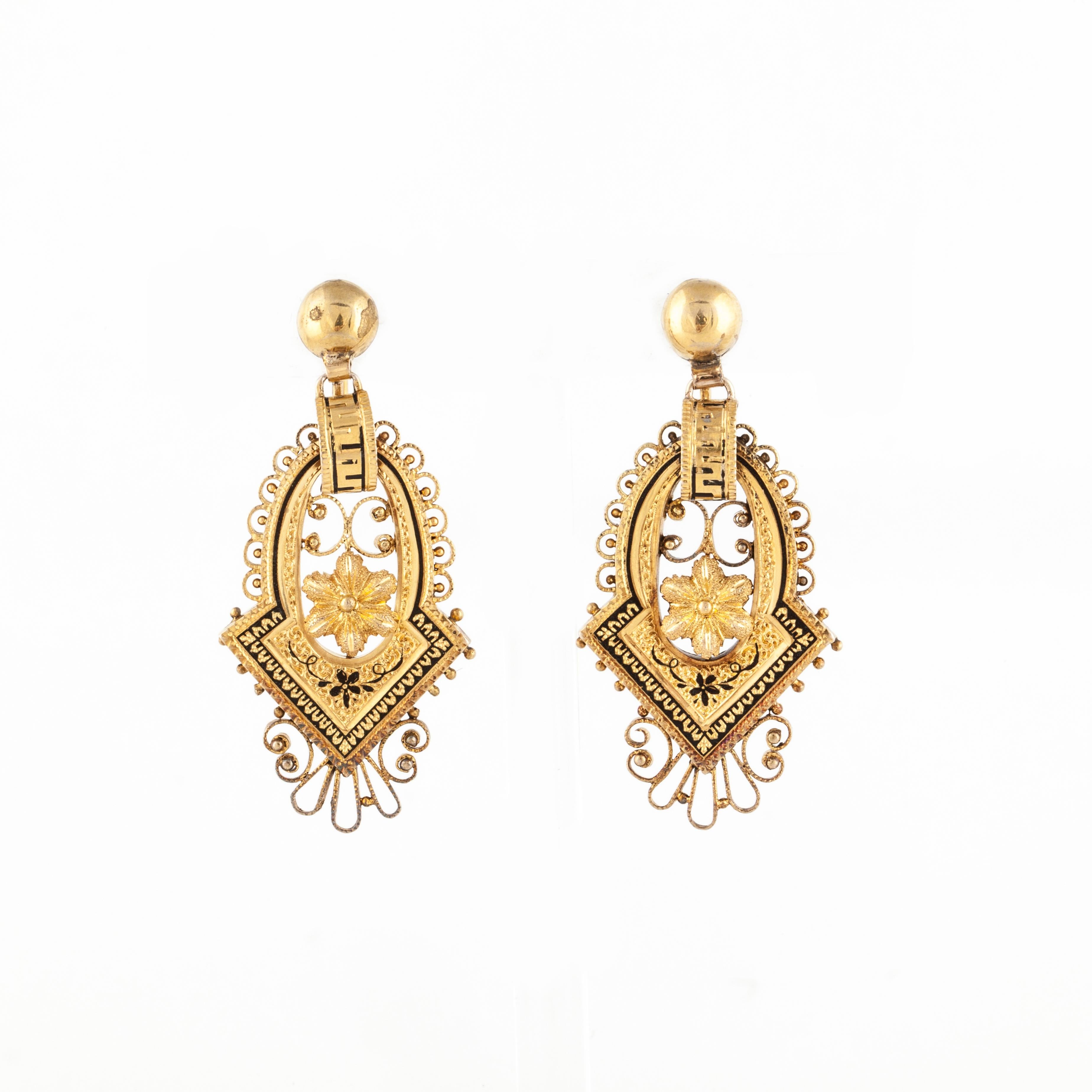 Victorian earrings crafted in 14K yellow gold with black enameling.  They measure 1 7/8 inches long by 7/8 inches wide.  They are screw backs.  Please note, there is very minor enamel loss.