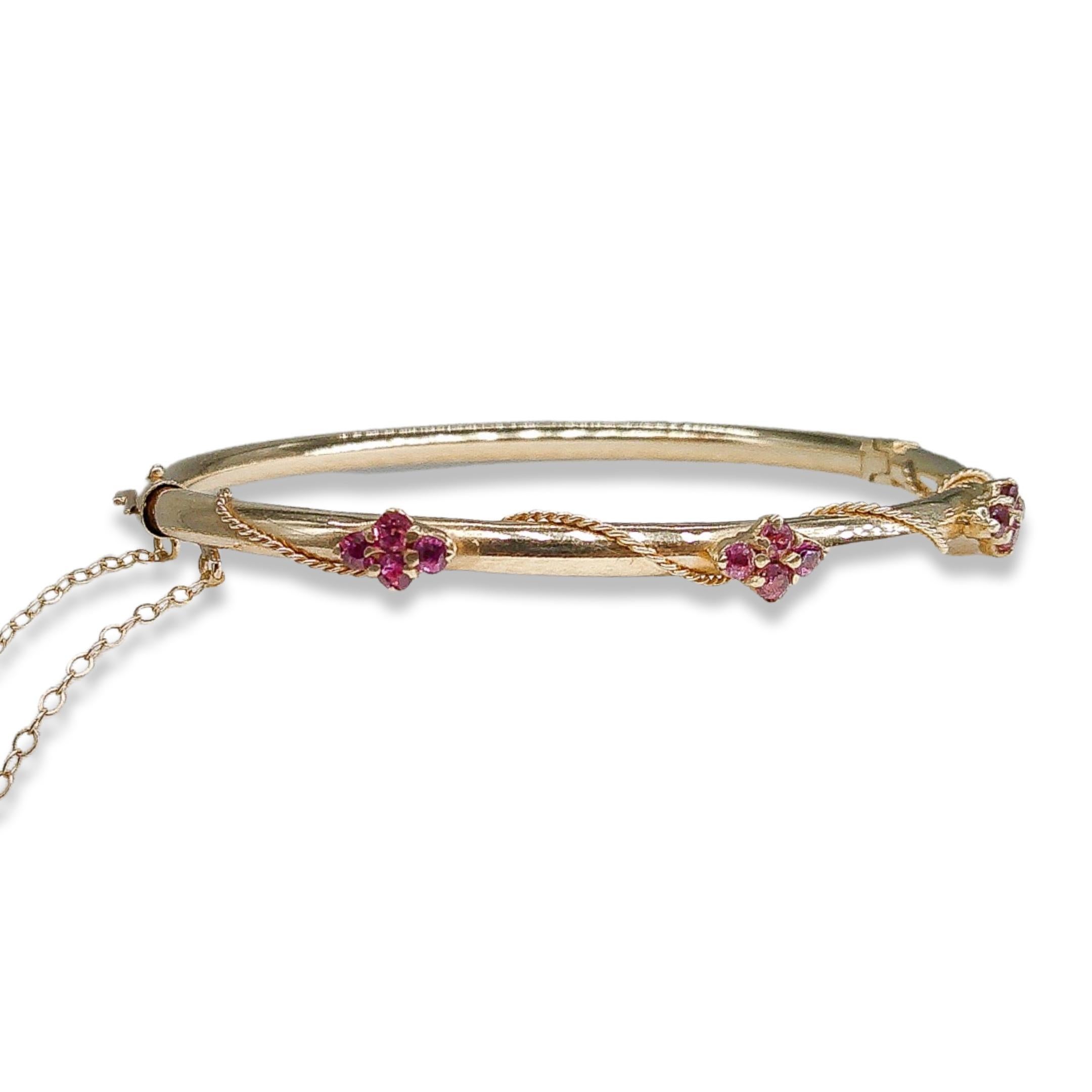 Step into a world of enchantment and grace with our captivating Victorian Garnet Bangle. This exquisite piece is a symphony of 14k gold and glistening garnets, meticulously crafted to transport you to an era of whimsy and sophistication.
 
Imagine
