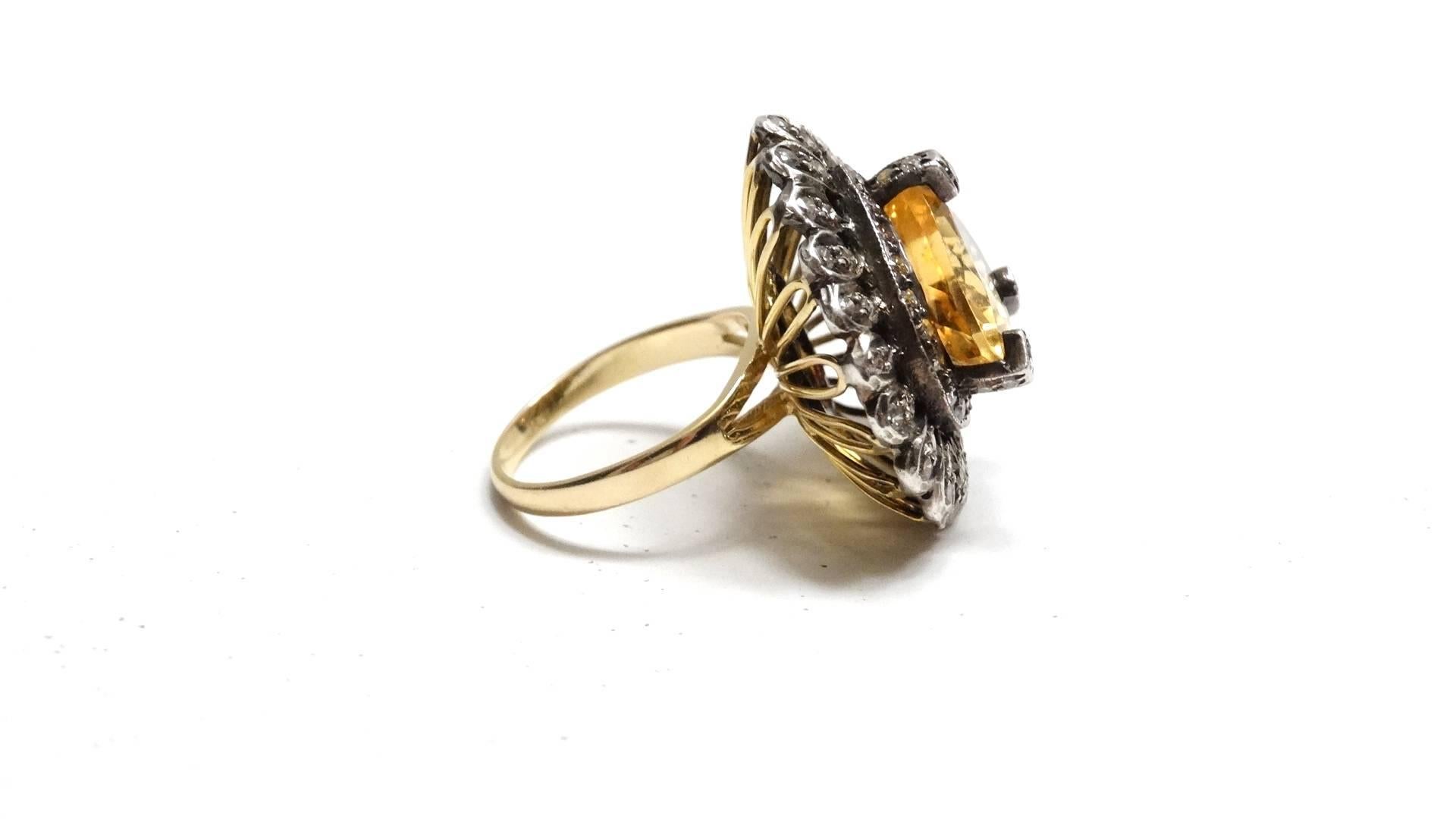 This fabulous 14 karat yellow and white gold ring boasts a beautiful natural Citrine.  The Citrine is 8.60 carats which is hand cut, beautifully polished and surrounded by a halo of Old Cut Diamonds. 44 sparkling Diamonds to be exact. Beautiful