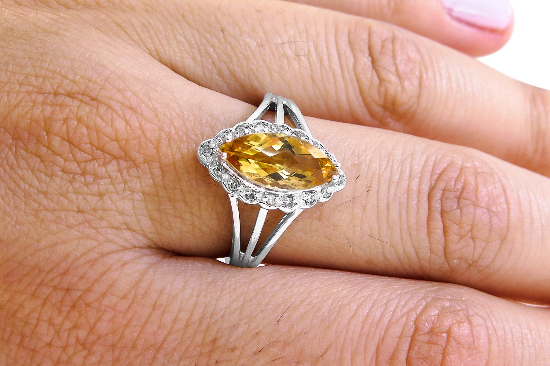 14k White Gold
Weight= 3.6gr 
Size= 7 
Diamond= 0.15 ct total 
Topaz= 2 ct  total
