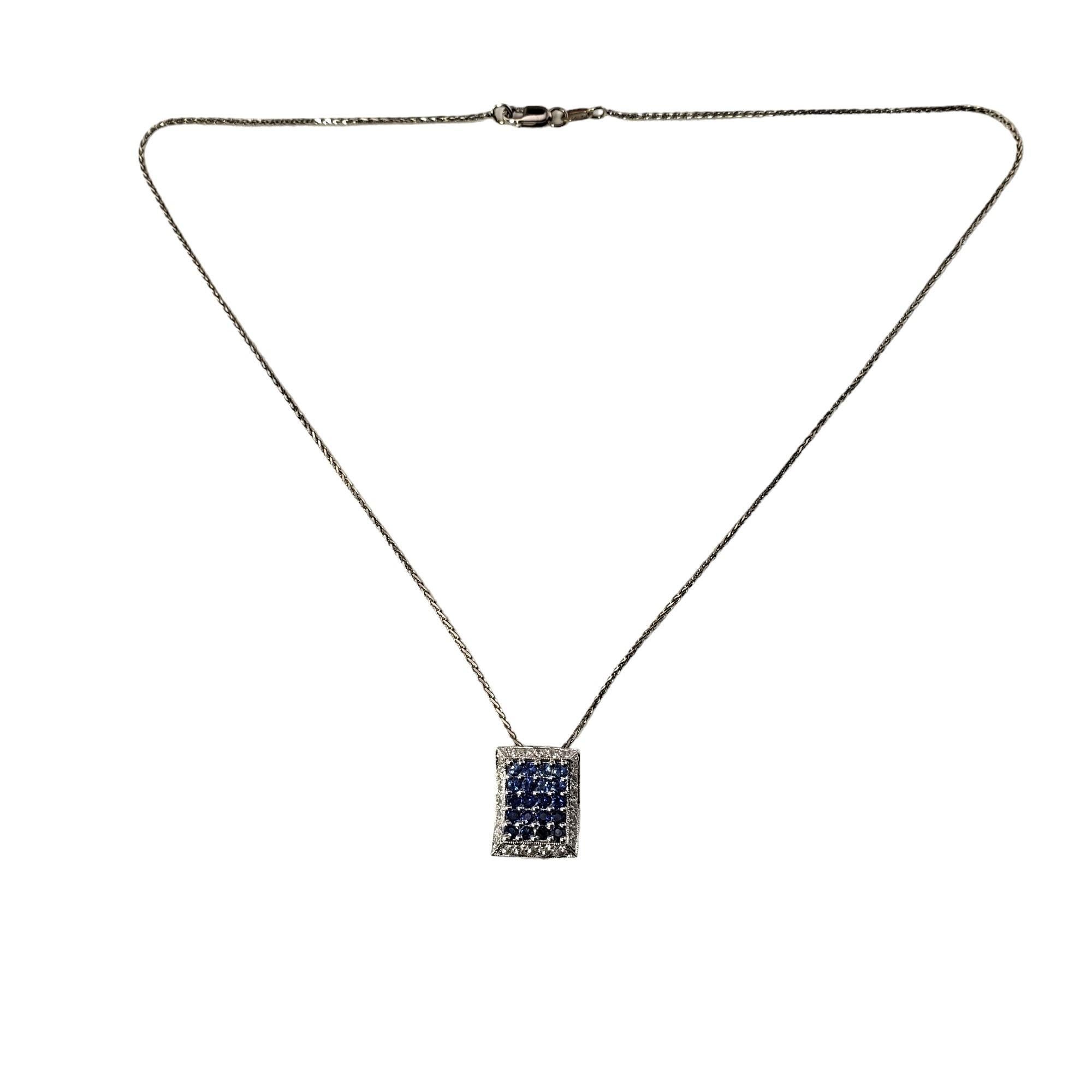 Vintage 14 Karat White Gold Blue and White Sapphire Pendant Necklace-

This elegant pendant necklace features 20 round blue sapphires and 24 round white sapphires set in beautifully detailed 14K white gold.

Total blue sapphire weight:  .80