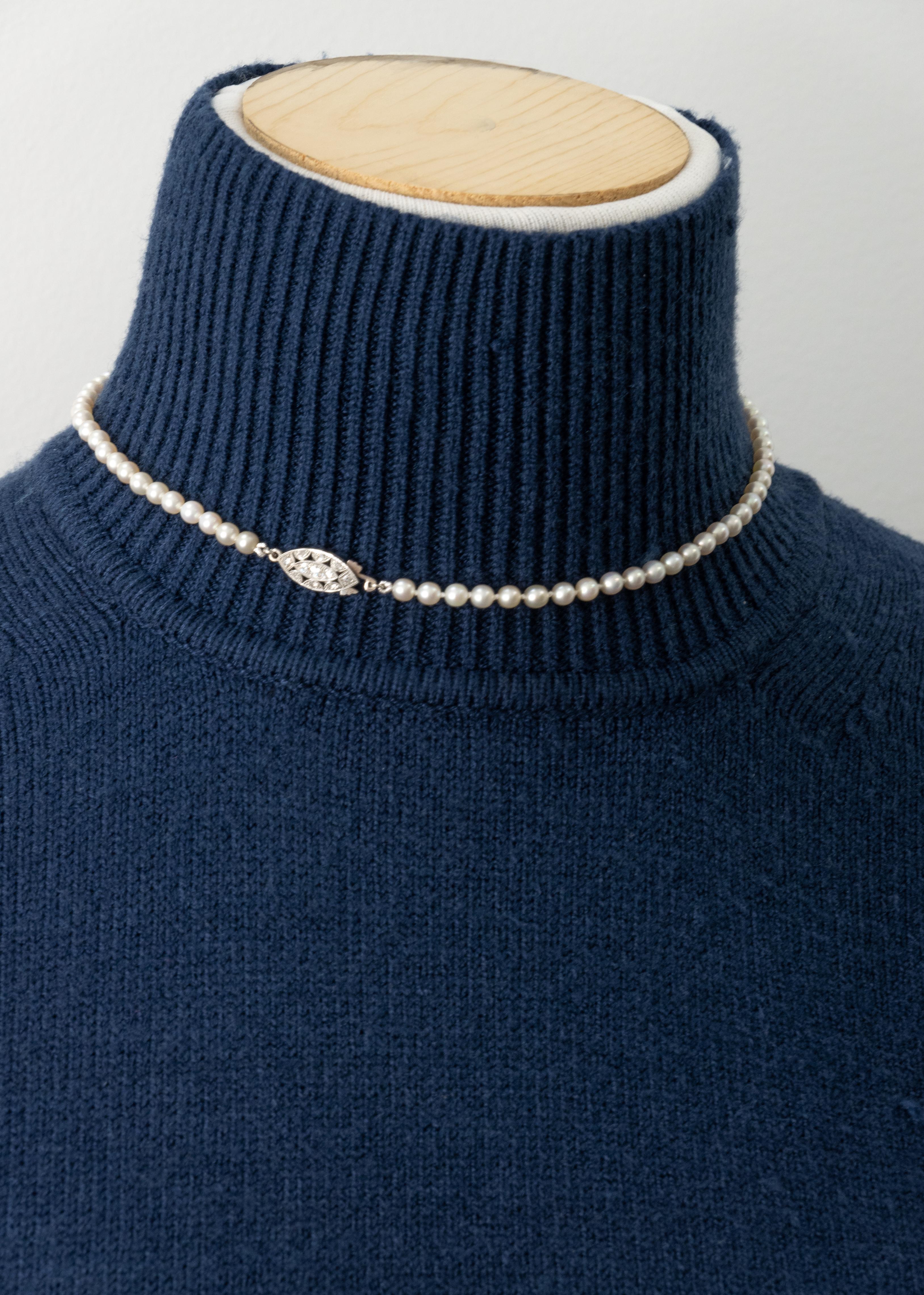 14K white gold GIA certified natural saltwater pearl necklace with a diamond clasp set with 11 single cut diamonds approximate H color VS-SI clarity

Approximate Weight: 9.5 grams

Approximate Measurement:
Necklace - 15.5” long
Pearl - 3.92mm -