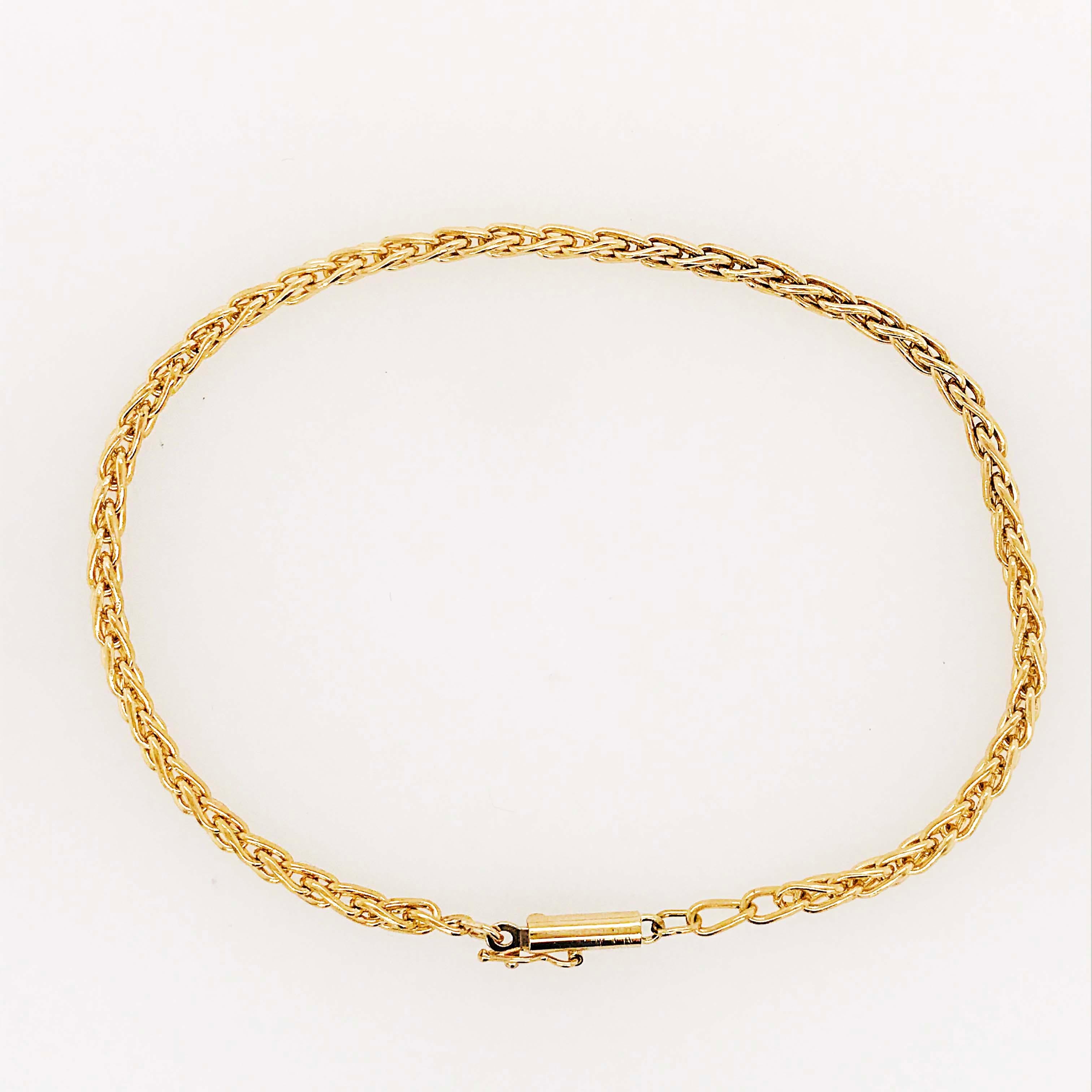 The 14 karat yellow gold bracelet has a heavy wheat design that is beautiful alone or paired with other bracelets. It has a beautiful barrel clasp and safety latch constructed out of 14k solid gold.   Your wrist will be a little happier with this