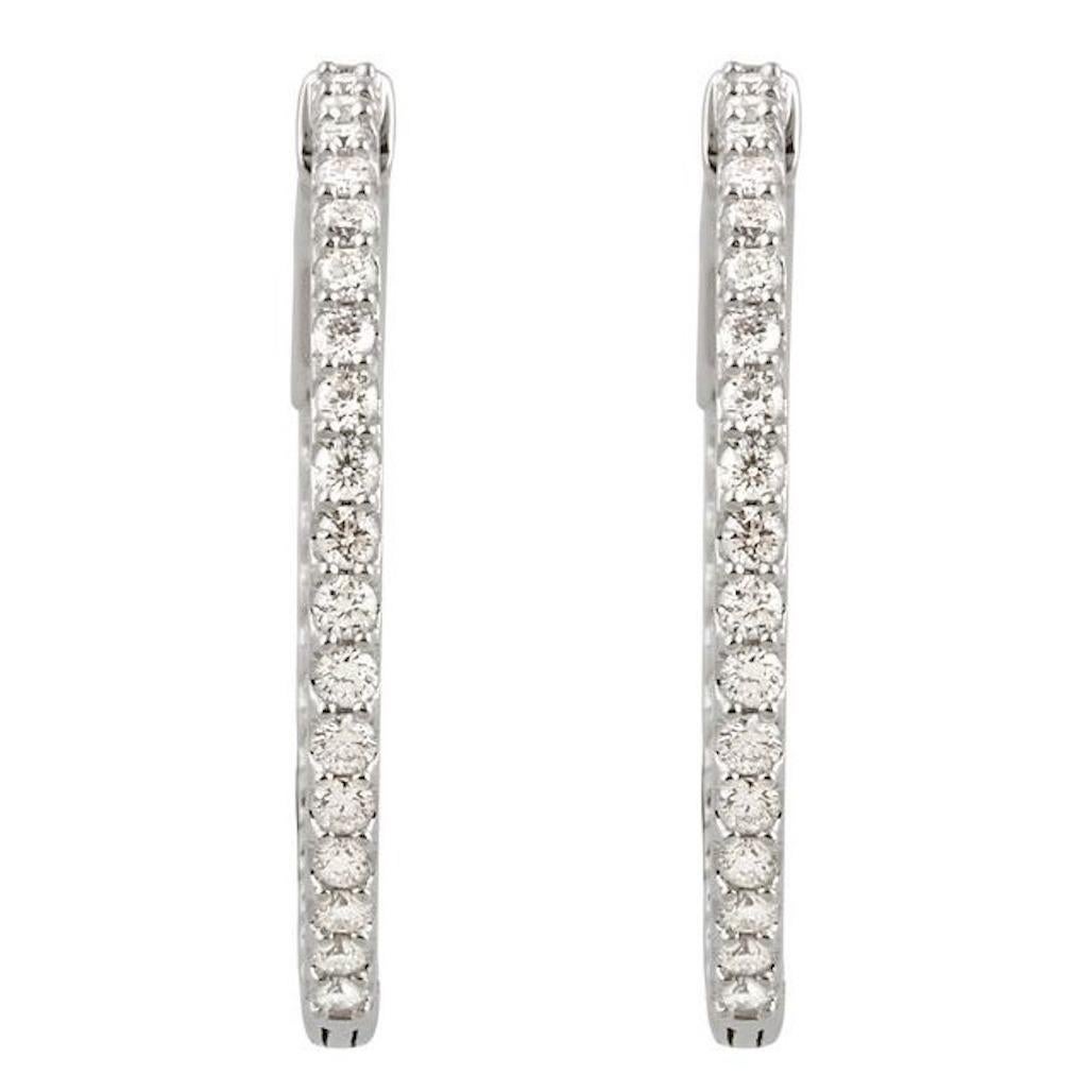 14-karat white gold diamond inside/outside hoop earrings are quality inside and out. These timeless beauties come in selective sizes. Brilliant round-cut diamonds are set in a solid gold setting consisting of four prongs for each diamond. The