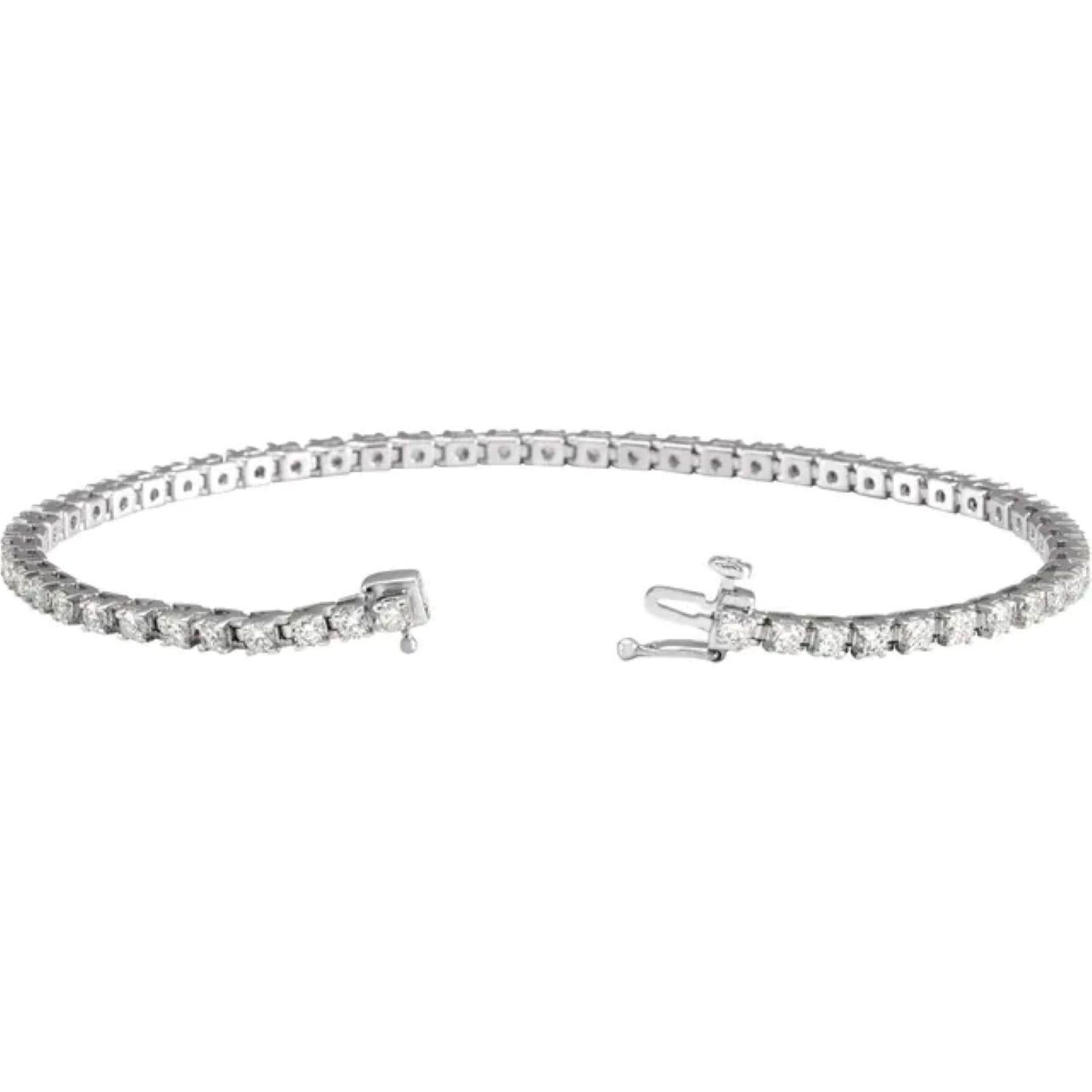 Specifications
Weight:	8.01 DWT (12.46 grams)
Solid/Hollow:	Solid
Bracelet/Anklet Size:	7 1/4 In
Primary Stone Type:	Natural Diamond
Prong Count:	4-prong
Bracelet Closure Type:	Hidden Clasp
Bracelet Type:	Line
Selling Unit of