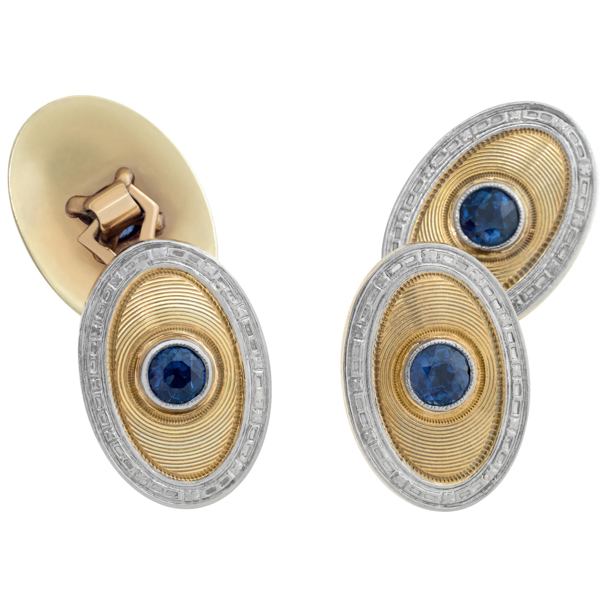 14k white and yellow gold cufflinks with approximately 2 carats in blue sapphire accents. Length 19mm.

