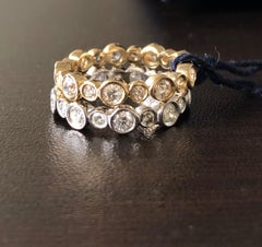 Bagues d'éternité en or blanc et jaune 14 carats avec diamants en serti clos