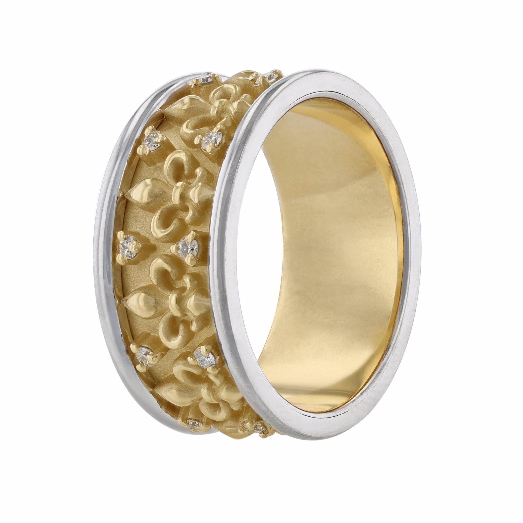 This men’s eternity band is 14K white and yellow gold. It features a pattern of fleur de lis with 20 round cut diamonds. All stones are prong set and weigh 0.48 carats combined. The ring has a color grade (H) and a clarity grade of (SI2)