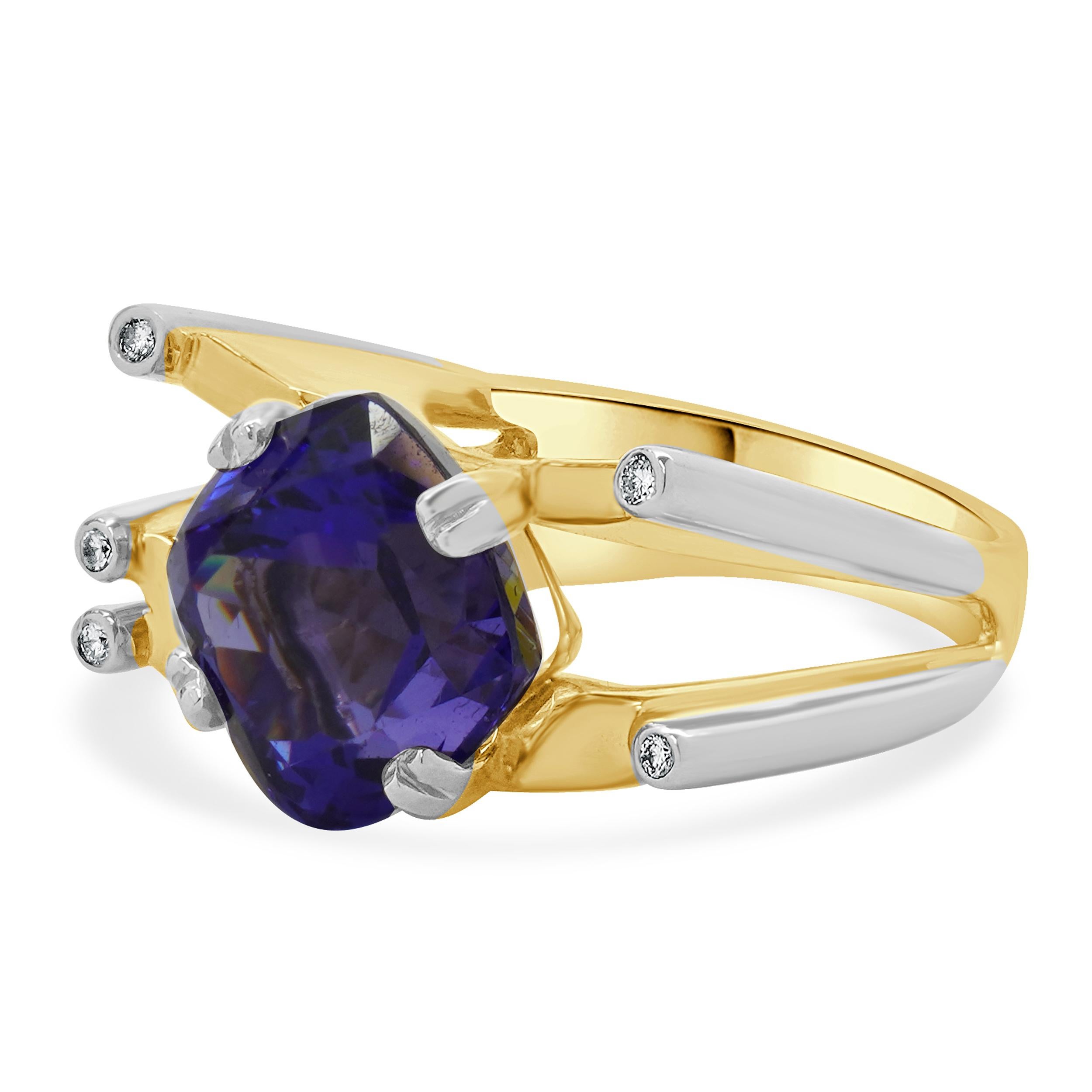 Designer: custom
Material: 14K white and yellow gold
Diamond: 5 round brilliant cut = 0.05cttw
Color: I
Clarity: SI2
Tanzanite: cushion cut = 9.93cttw
Ring Size: 8.5 (please allow two extra shipping days for sizing requests) 
Weight: 17.10 grams