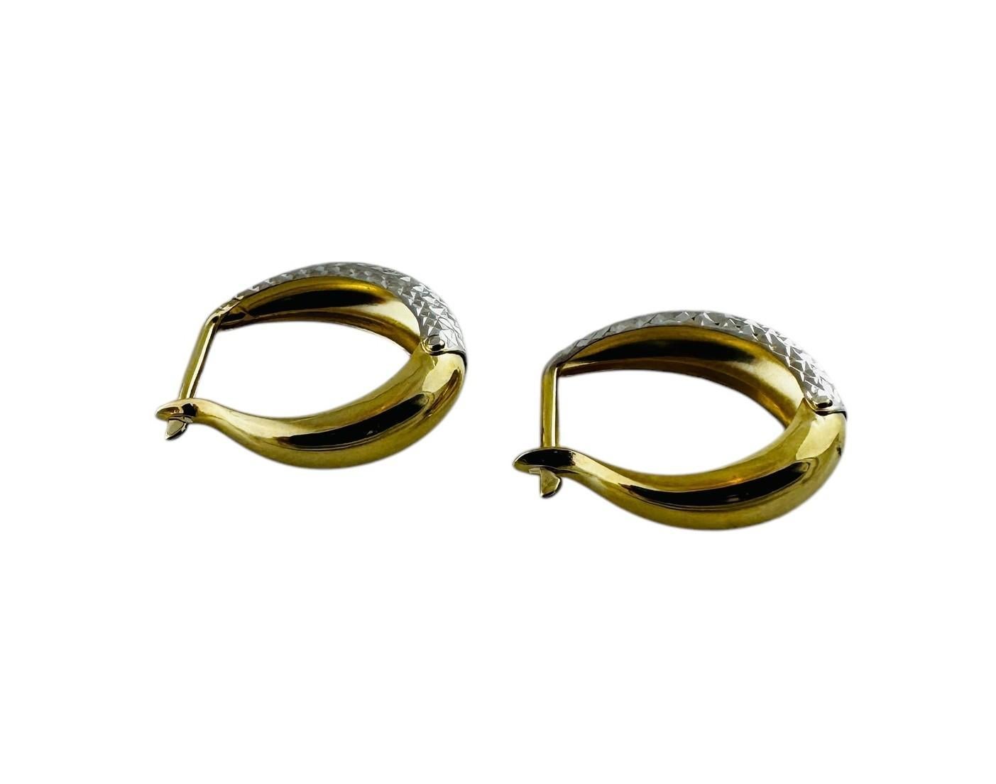 14K White and Yellow Gold Two Toned Oval Diamond Cut Hoop Earrings

These beautiful hoop earrings have yellow gold backs and posts and a diamond cut textured white gold front.

Stamped : 14K

1.56 g / 1 dwt

Measurements: 16 mm in length, 5.13 mm