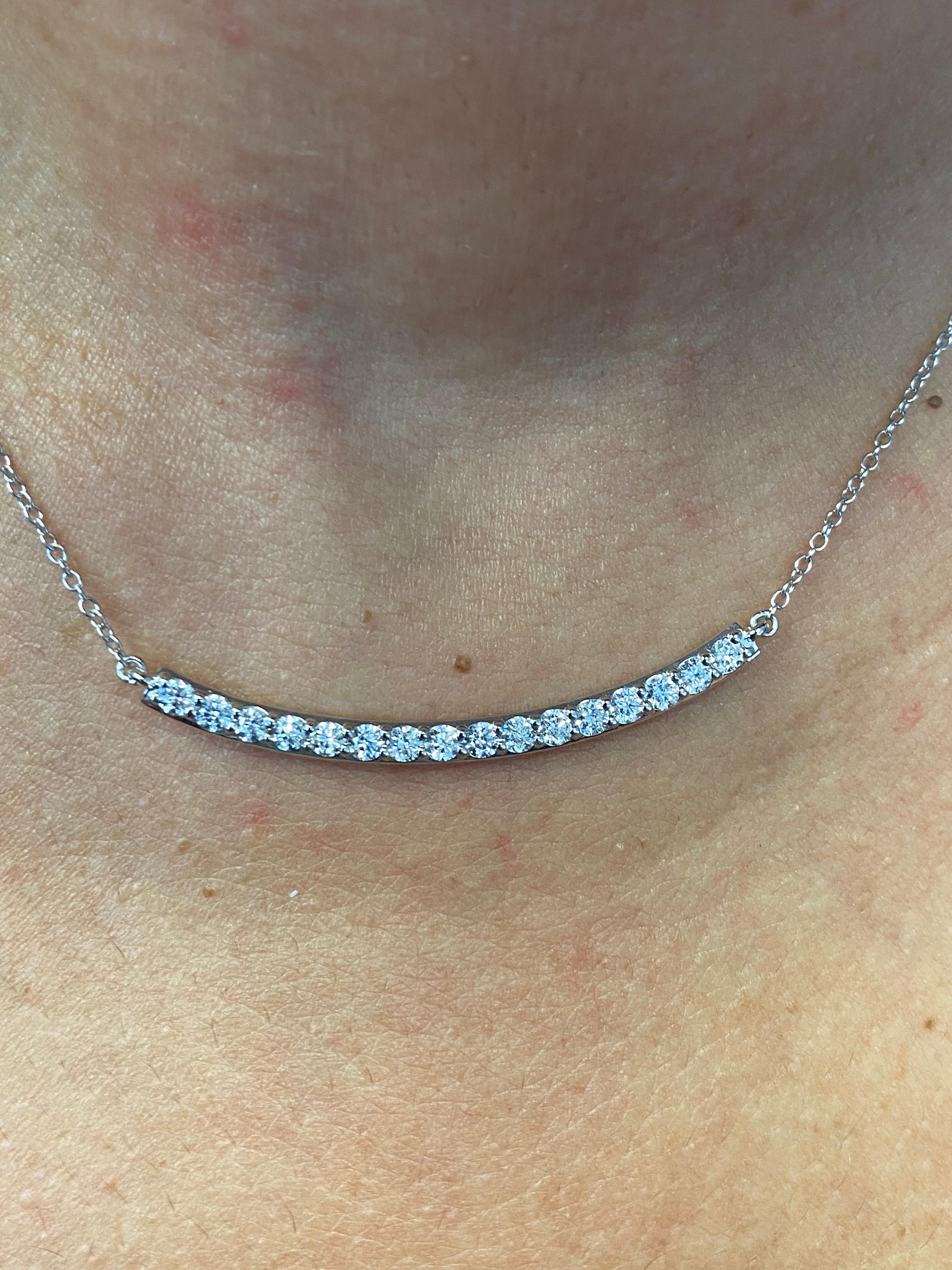 Diamond bar pendant set in 14K white gold. The pendant is set with 16 stones each weighing 0.07 carats. The total diamond weight is 1.12 carats. The stones are G-H, SI clarity. The total length is 16 inches.