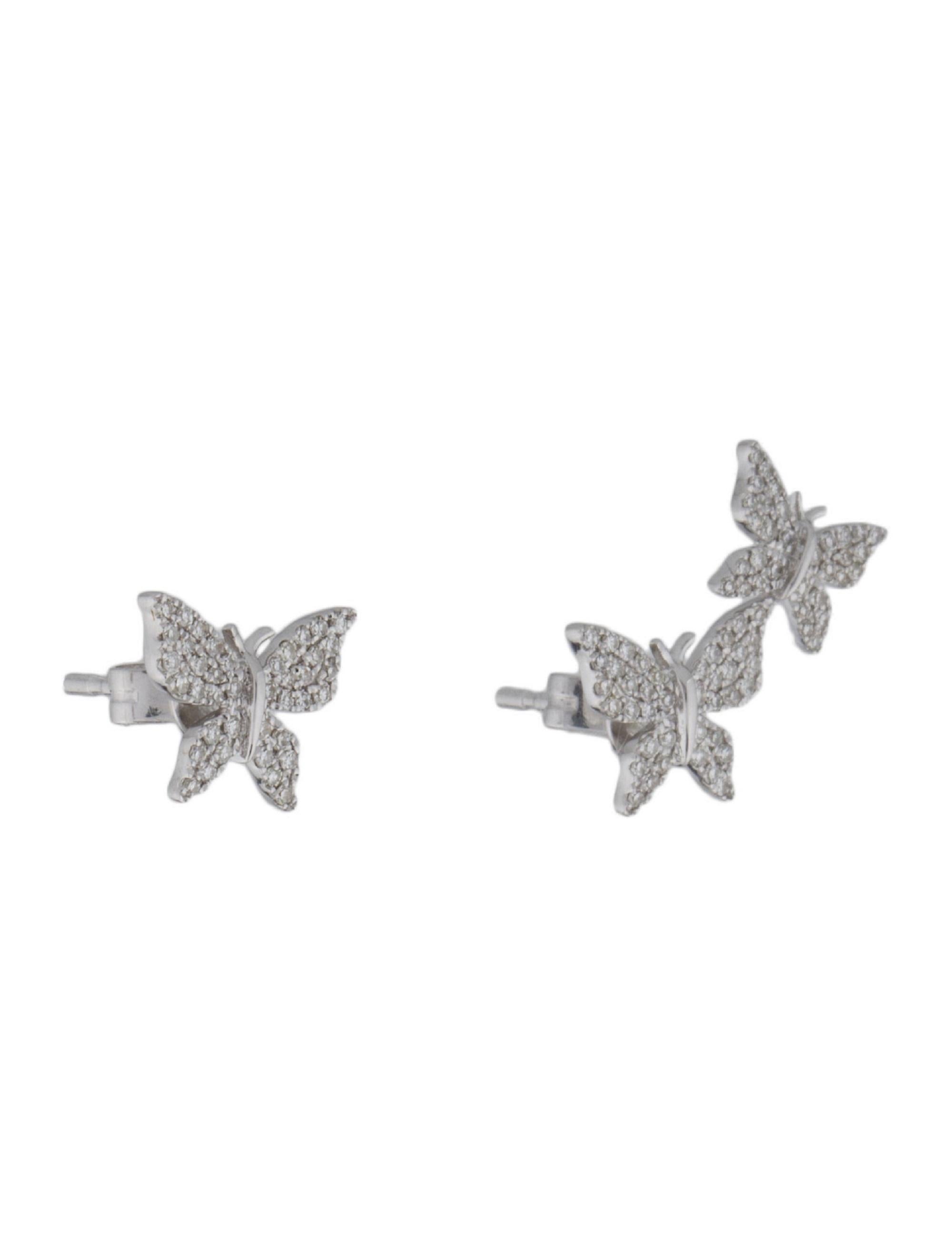 These trendy and sweet Mismatched Butterfly Earrings crafted of 14k gold and round diamonds create an illusion of a second ear piercing although its just an ear climber on one side! Featuring approximately 0.35ct of diamonds GH-SI color and clarity.