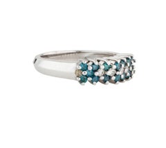 Anneau en diamants blancs et diamants bleus 14 carats