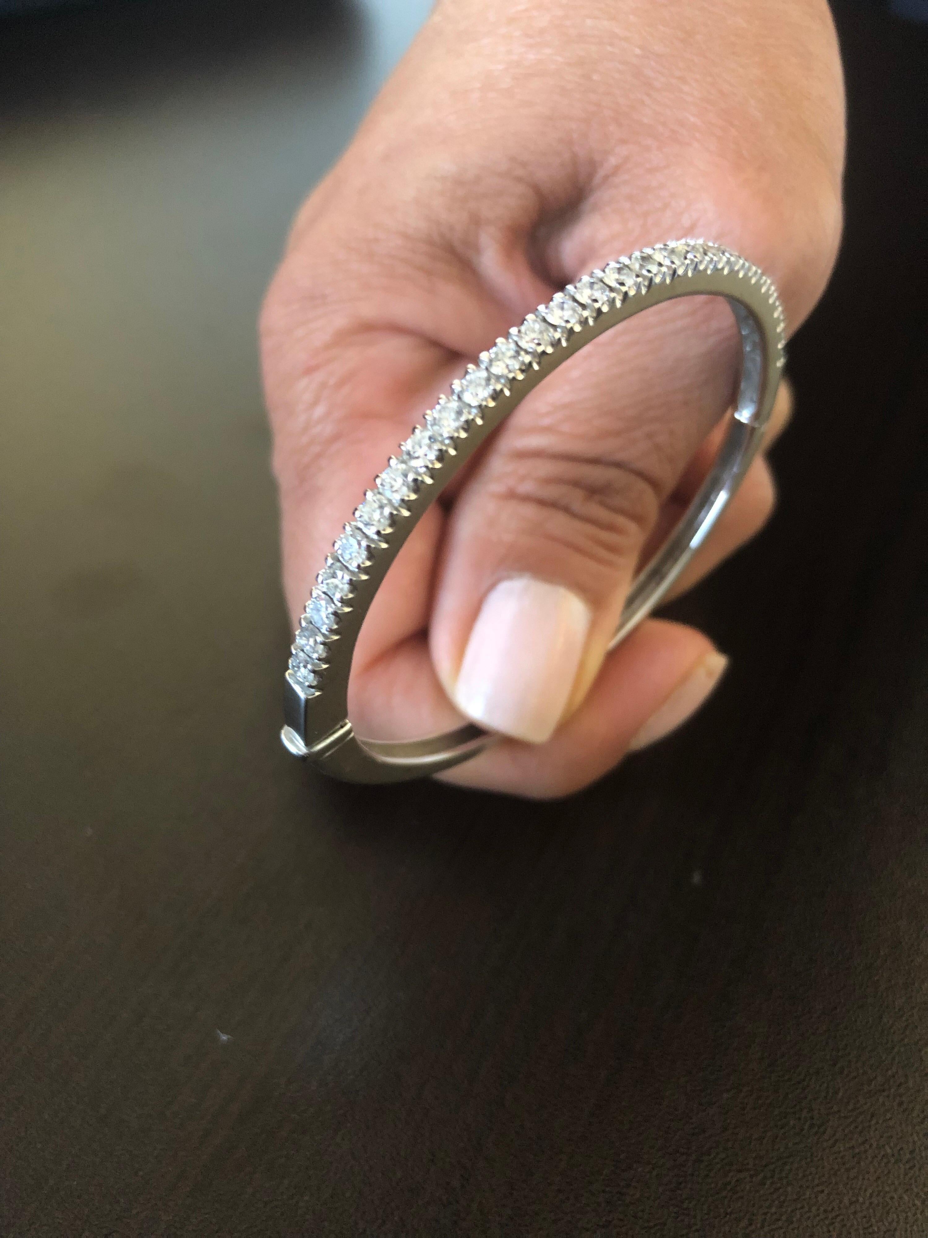 Half-Way diamond bangle set in 14K white gold. Each stone weights 0.07 carats each. The total weight of the bangle is 2.30 carats. The color of the stones is G, the clarity is SI.