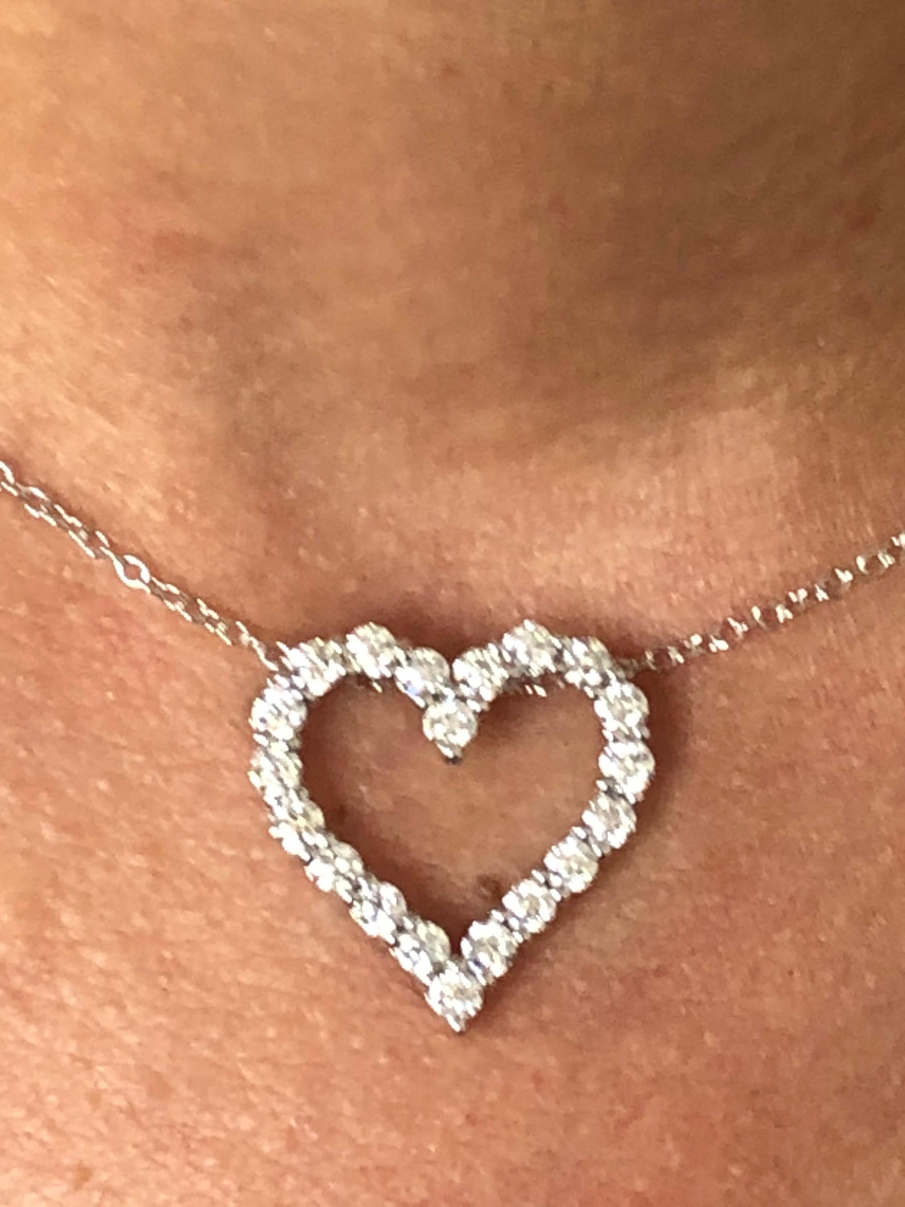 Diamond heart pendant set in 14K white gold. The pendant is set with 20 stones each weighing 0.07 carats. The total weight is 1.40 carats. The color of the stones are G-H, the clarity is SI. The heart is set on an 18 inch chain.