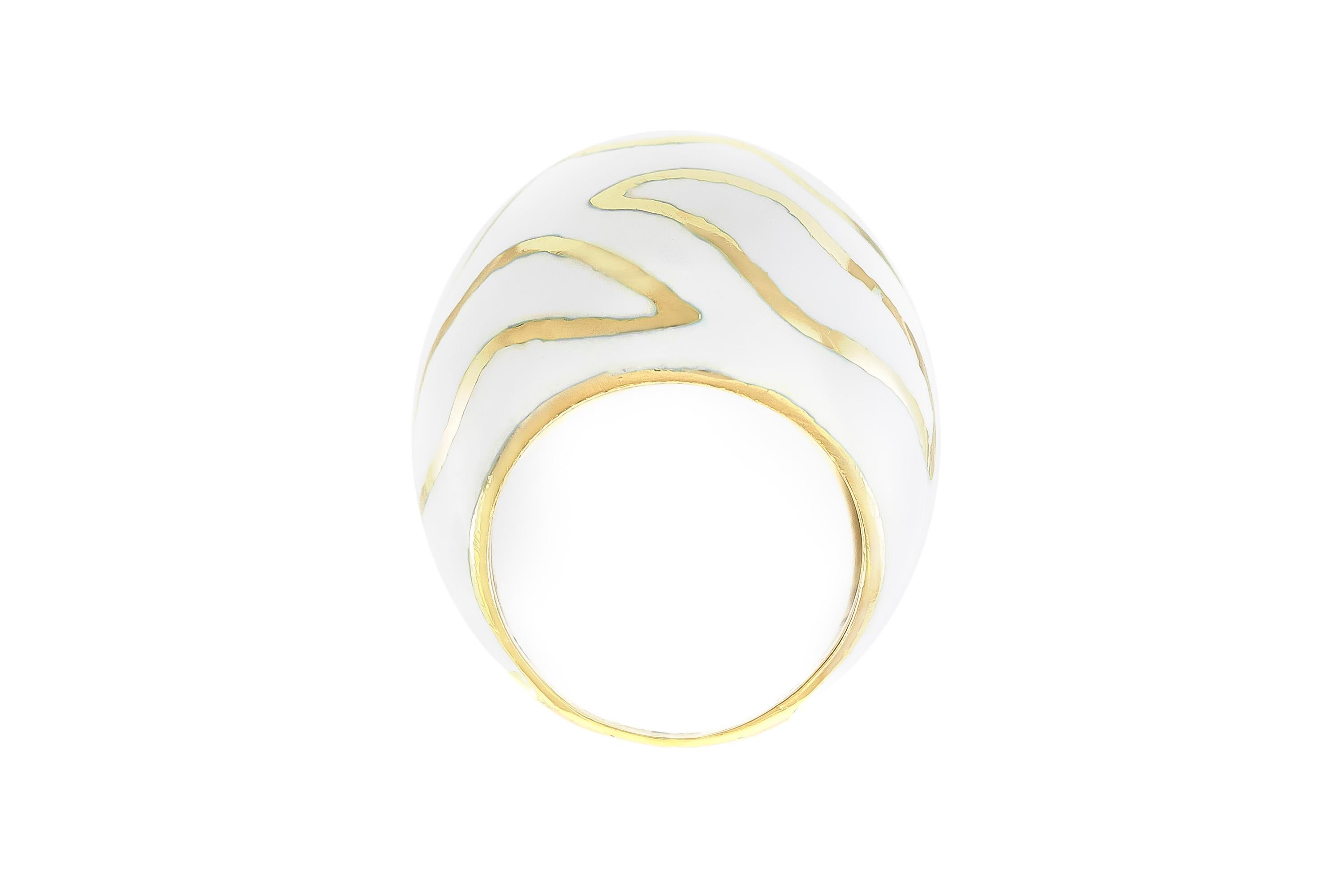 The ring is finrly crafted in 14k yellow gold with high white enamel and 