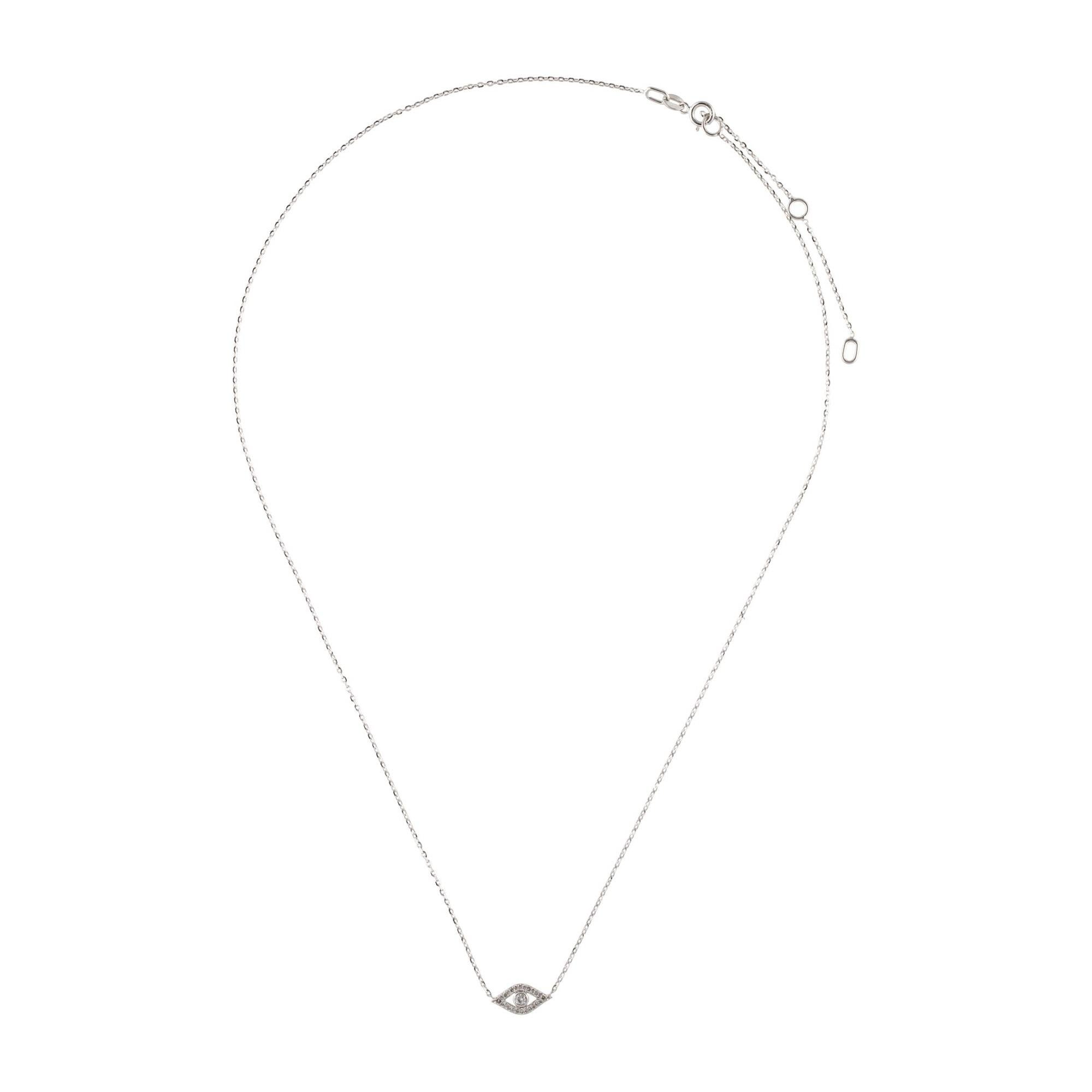 Chic and stylish, the hottest trend in jewelry fashion! Feel protected by this stunning Diamond Evil Eye Necklace featuring approximately 0.08 ct of sparkling white round diamonds. Crafted of 14K Gold/. Chain is adjustable to 16