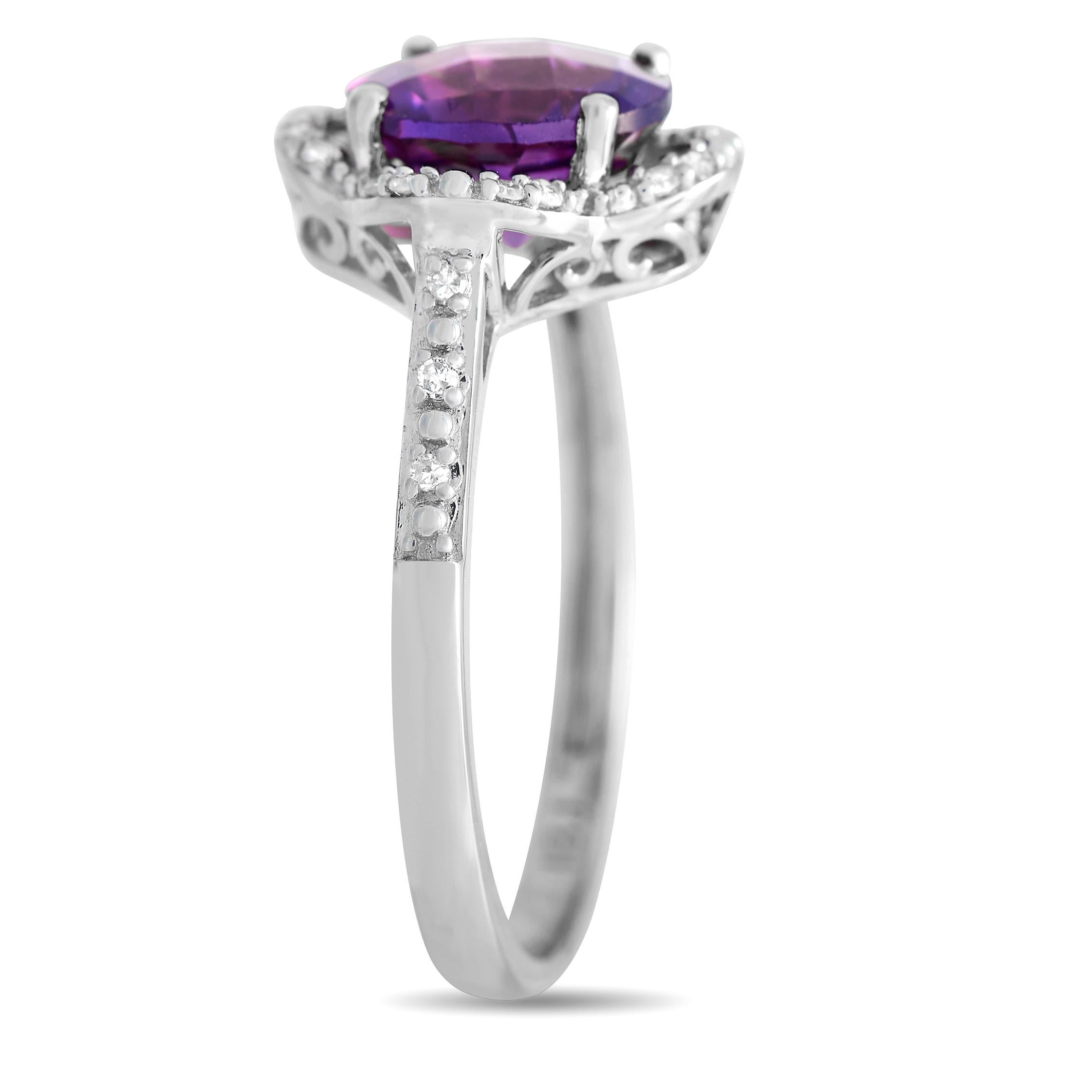 A stunning gift choice for a loved one born in February. This beautiful ring in 14K white gold is topped with a round amethyst, the February birthstone. The faceted purple gem is held by four prongs and surrounded by a quatrefoil-shaped frame traced