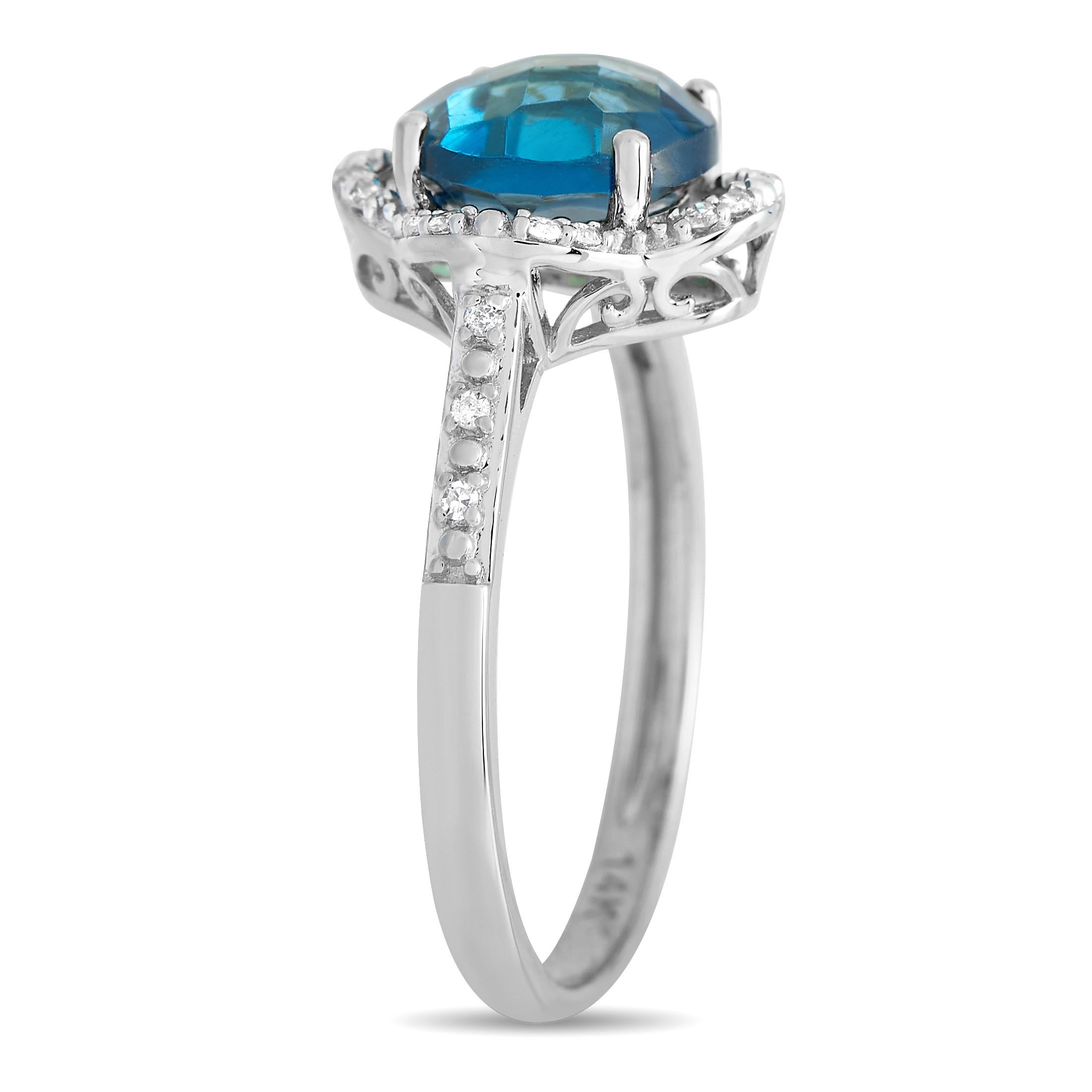 Wear this ring to add an instant positivity and color boost to your look. The ring has a slender band in 14K white gold, with rising shoulders decorated with diamonds. The centerpiece is a round topaz secured by four prongs and mounted on a