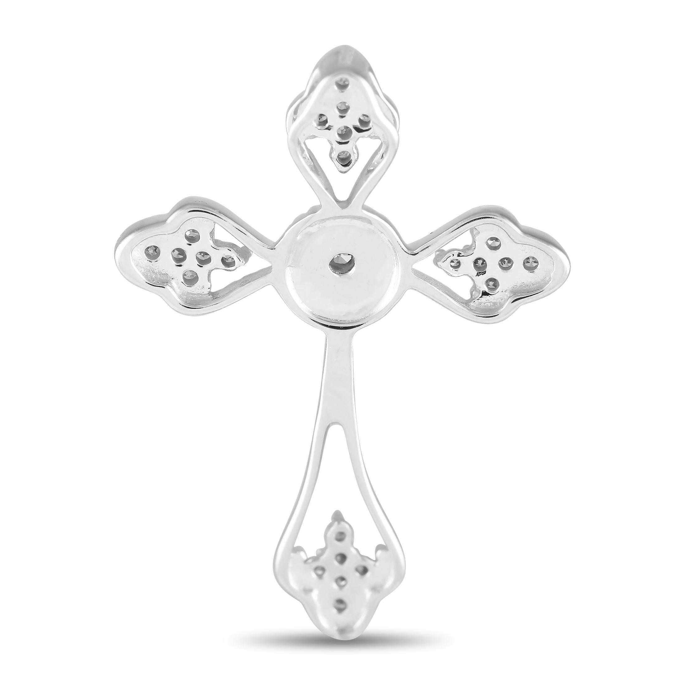 An affirmation of your faith, this diamond cross pendant makes a beautiful reminder of the divine presence and promise. It features a Latin cross silhouette with milgrain outline and diamond embellishment.This brand new 14K White Gold 0.10 ct