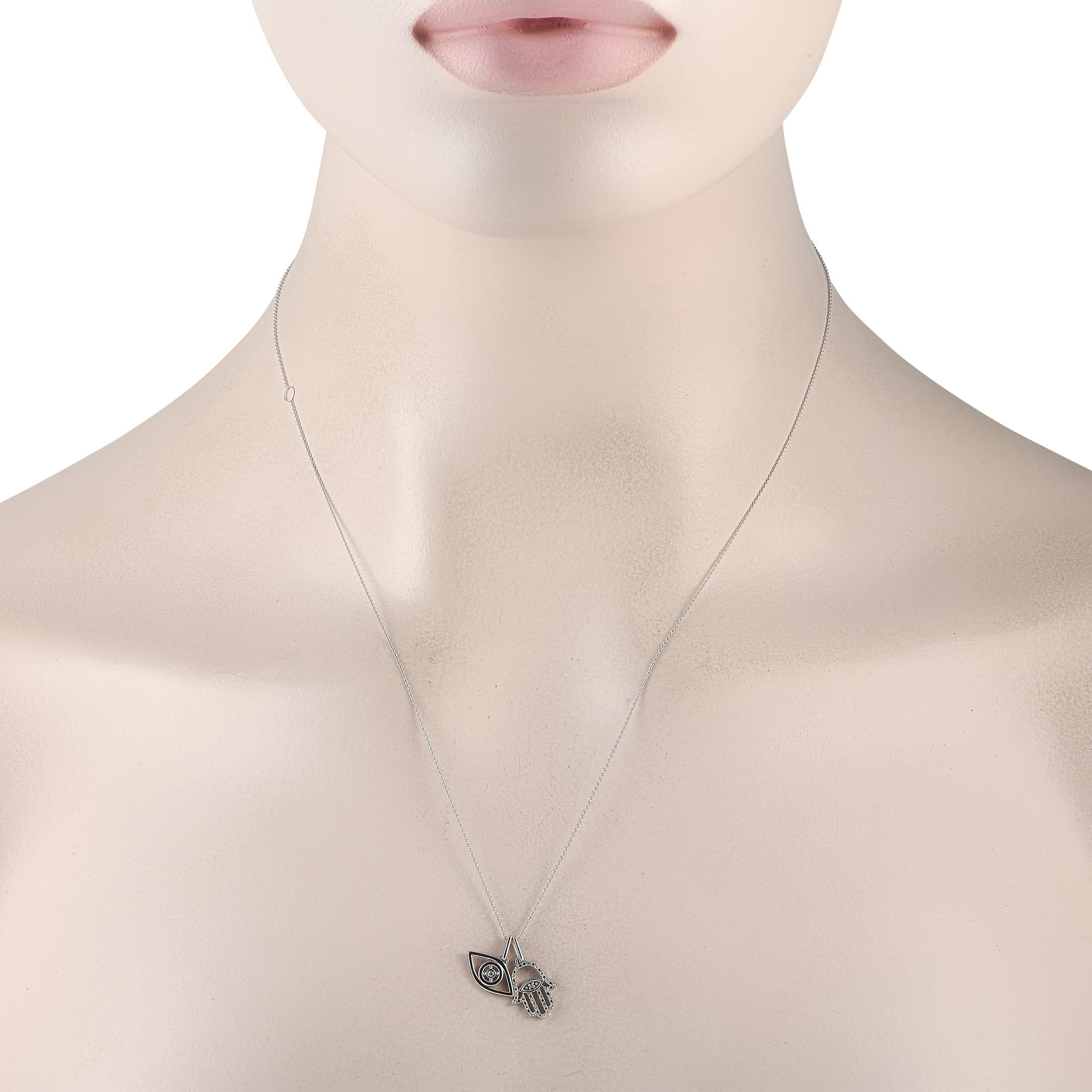 On this exquisitely crafted necklace, a pair of spiritual symbols are suspended at the end of a delicate 18 chain. The Hamsa symbol has long been used as an amulet of good fortune, while the Evil Eye symbol is said to ward off negative energy.