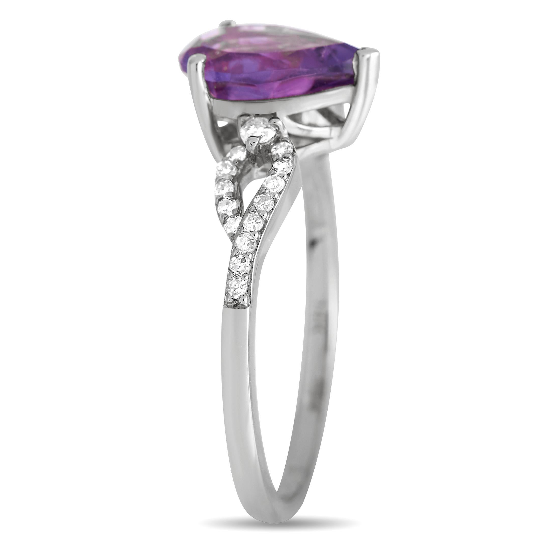 An opulent 14K white gold setting beautifully highlights a stunning amethyst center stone and diamond accents totaling 0.15 carats on this exquisite ring. Simple and stylish, this piece features a 2mm wide band and a top height measuring 6mm.This