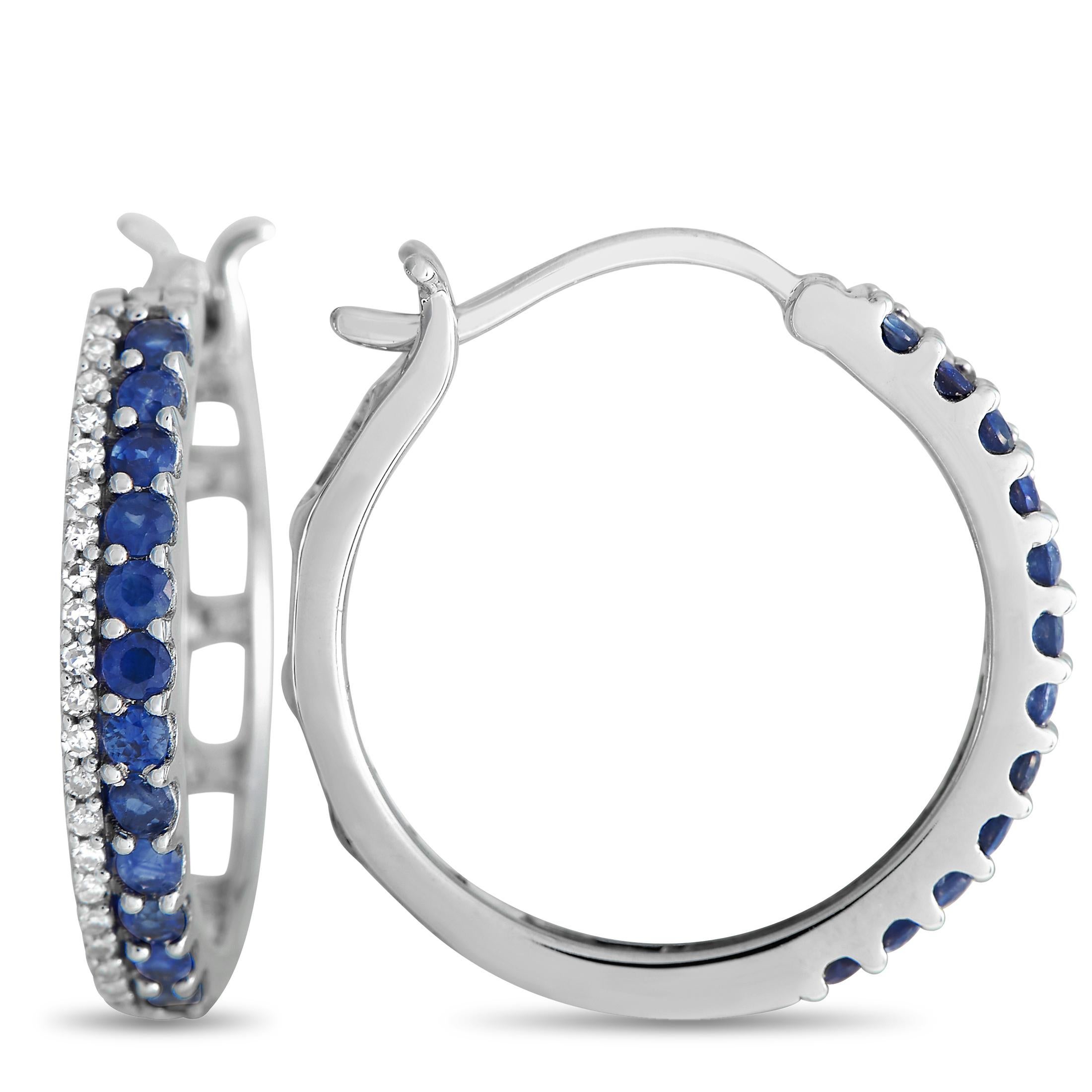 These earrings deliver a classy statement, no matter which outfit you pair them with. Each hoop measures less than an inch in diameter and is relatively lightweight. The hoops feature a row of petite round diamonds on shared prongs next to a row of