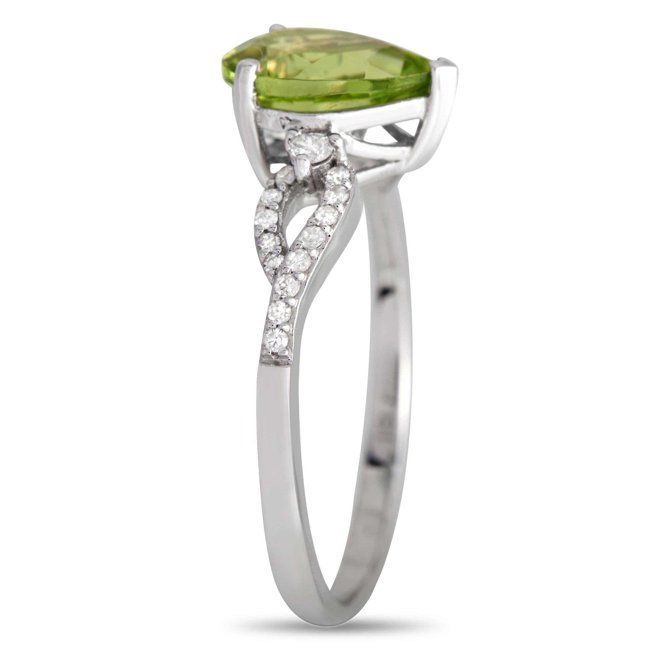 A captivating pear-shaped Peridot center stone is beautifully showcased by this rings intricate 14K White Gold setting. This piece features a 2mm wide band, a 6mm top height, and Diamond accents with a total weight of 0.15 carats.This jewelry piece