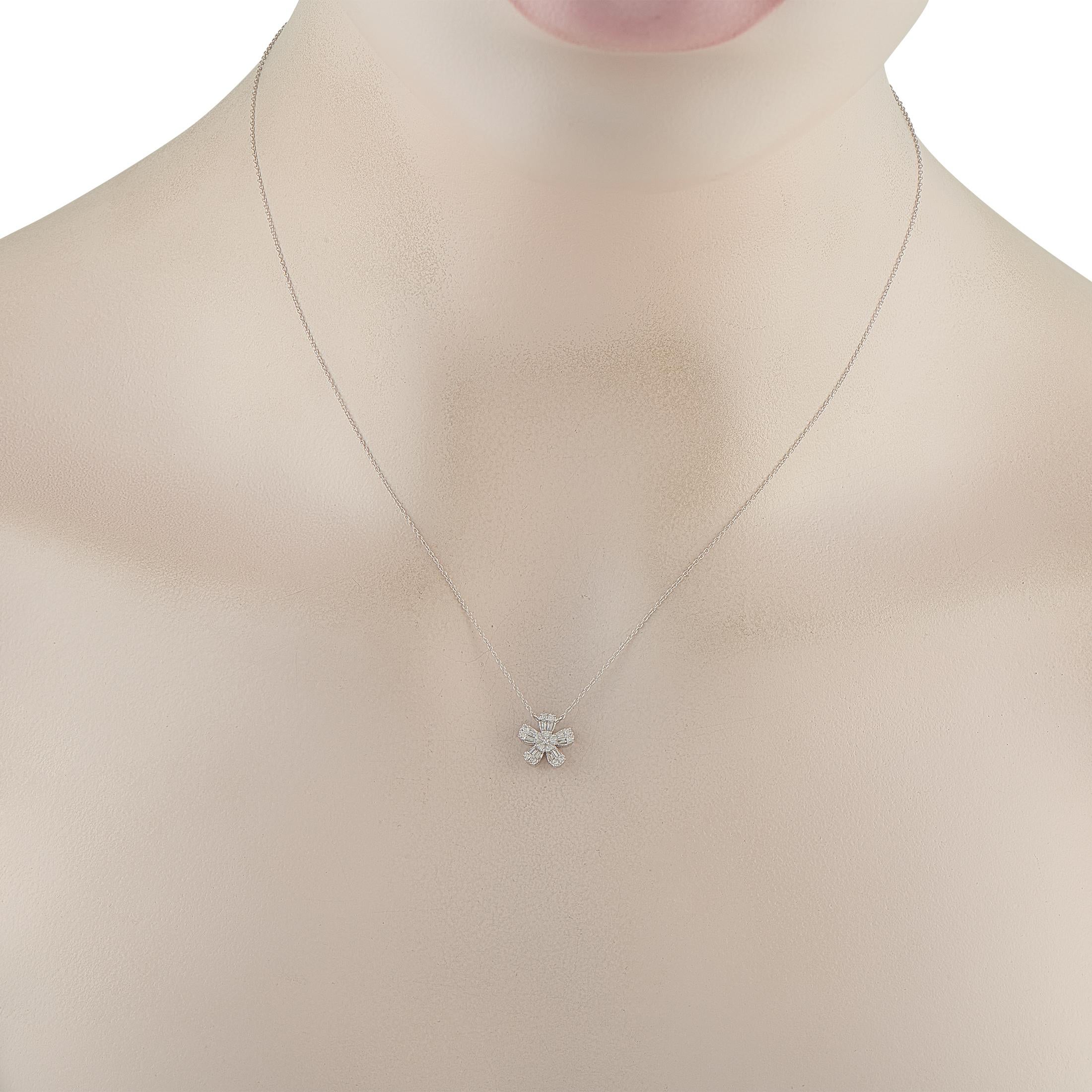 A minimalist design makes this 14K White Gold necklace ideal for any occasion. Simple and perfectly understated, it features a floral-shaped pendant covered in Diamonds totaling 0.20 carats. The pendant measures 0.38 round and is suspended from an