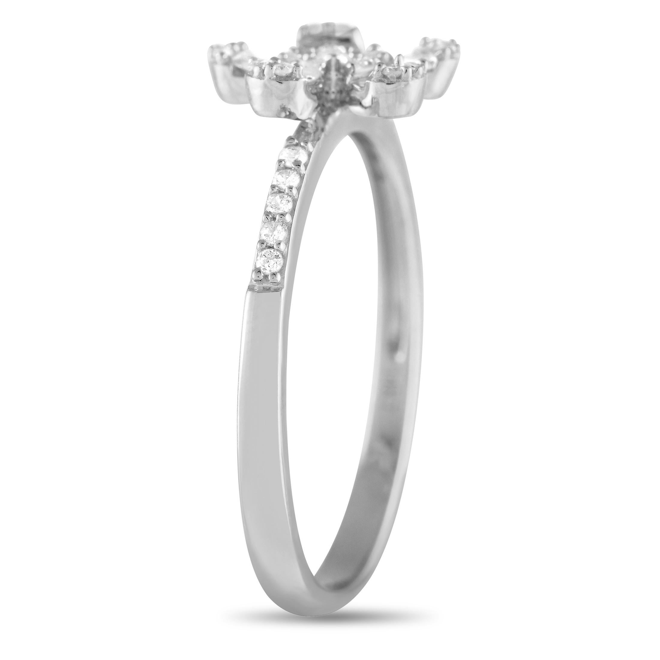 You'll love the elegant look and the laidback feel of this diamond ring. It is designed with a thin shank with petite round diamonds tracing the shoulders. The focal point is a flower motif with five pear-shaped petals embellished with a lovely