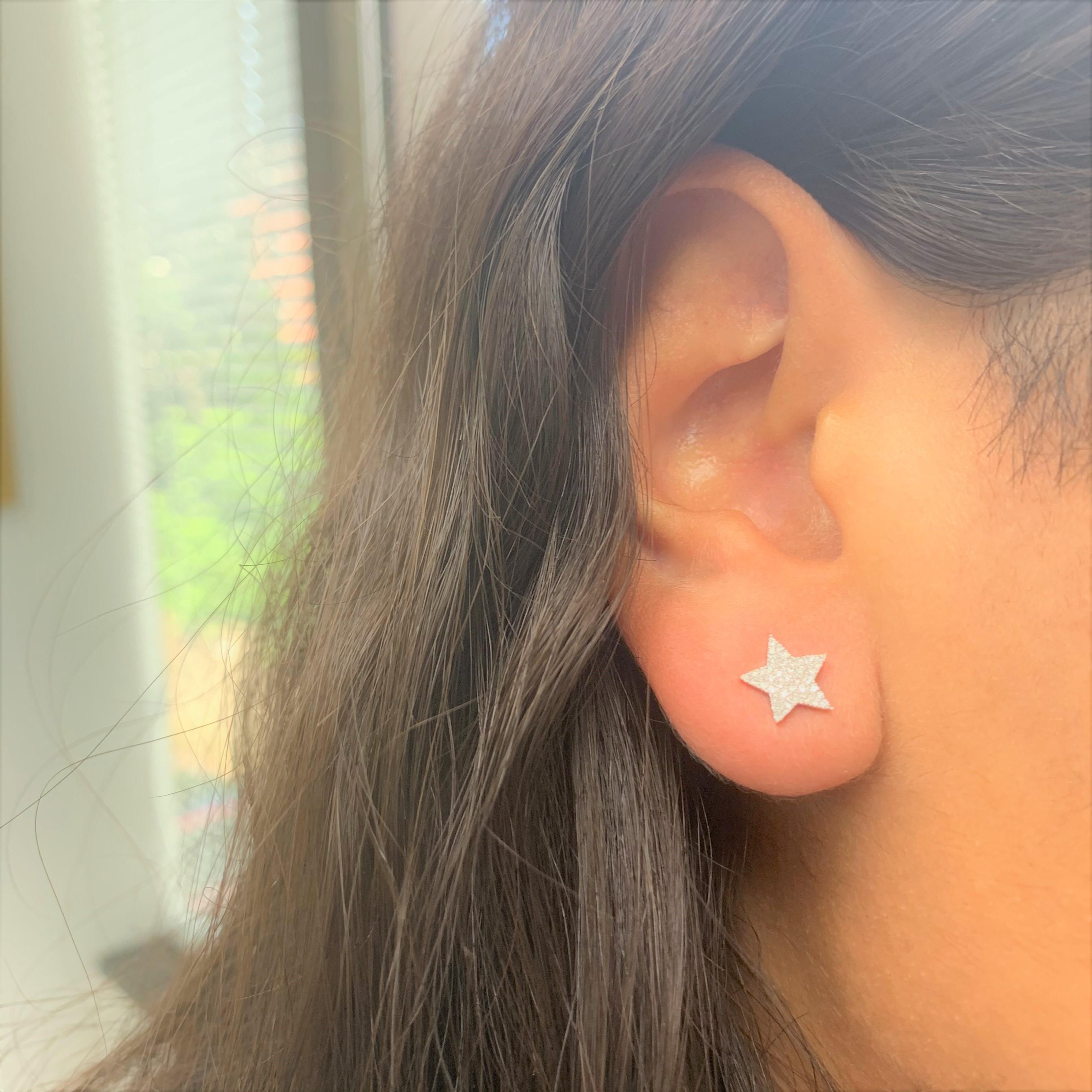 These star-shaped 14k Gold earrings feature approximately 0.21ct of sparkling white diamonds in pave settings and a high polish finish. Butterfly push-backs secure these 14-karat white, yellow or rose gold studs. Diamond color and Clarity GH SI1-SI2