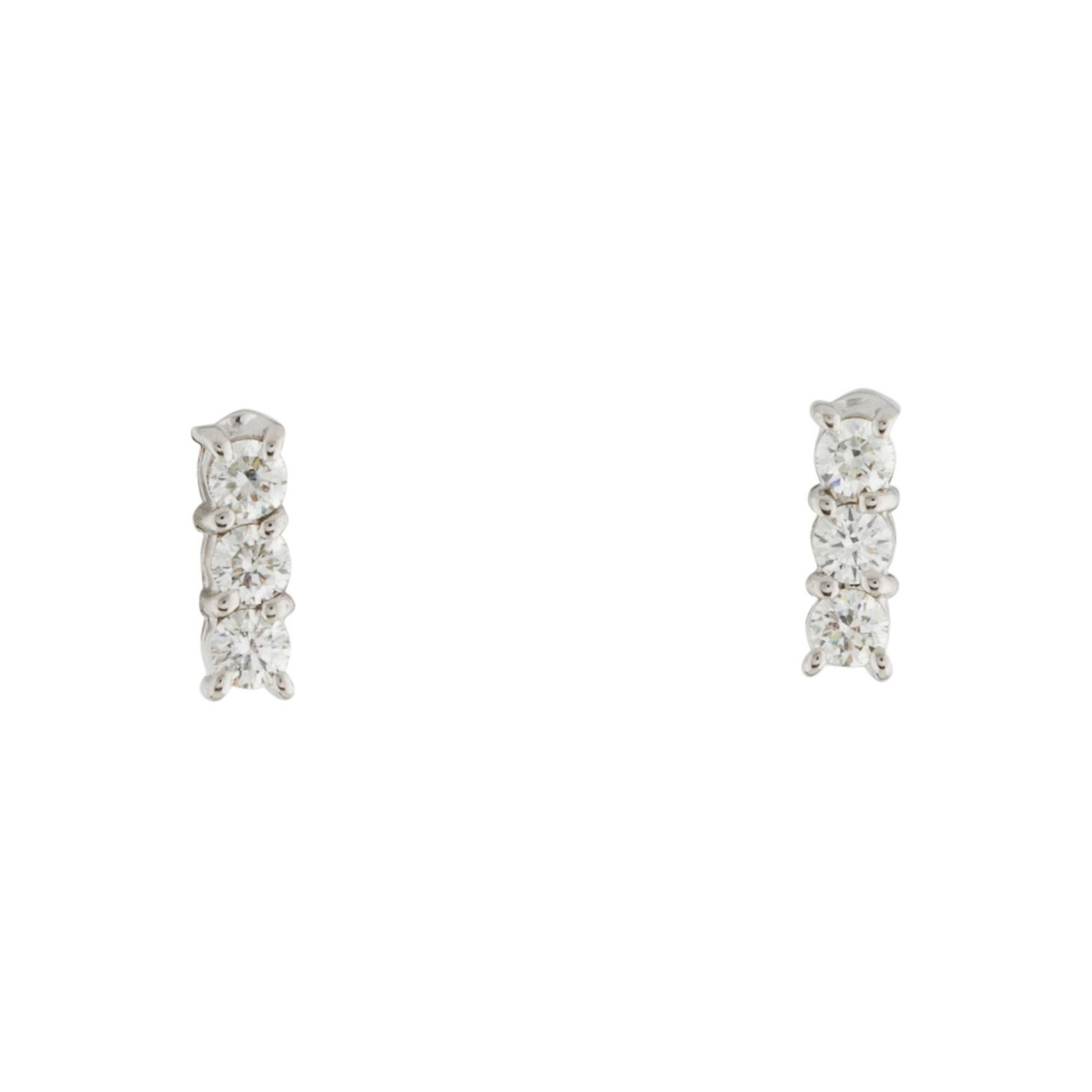 Crafted of 14K Gold these Classic and Pretty 3 Stone Diamond Bar Stud Earrings feature 6 Natural Round Diamonds weighing approximately 0.25ct. Diamond Color & Clarity is GH-SI. Butterfly Push-back closure. Available in White, Yellow & Rose