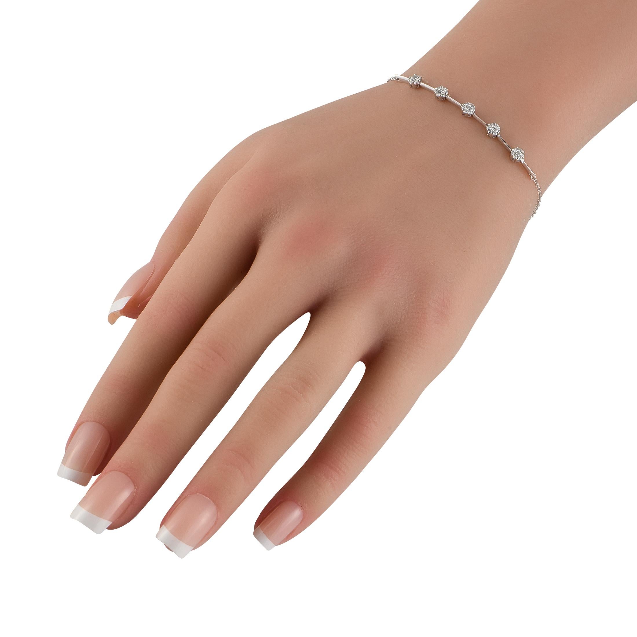 This impeccably crafted bracelet is equal parts charming and sophisticated. At the center of the 7 chain, Diamonds totaling 0.25 carats in a series of floral motifs make a statement in the 14K White Gold setting. A sleek design makes this piece